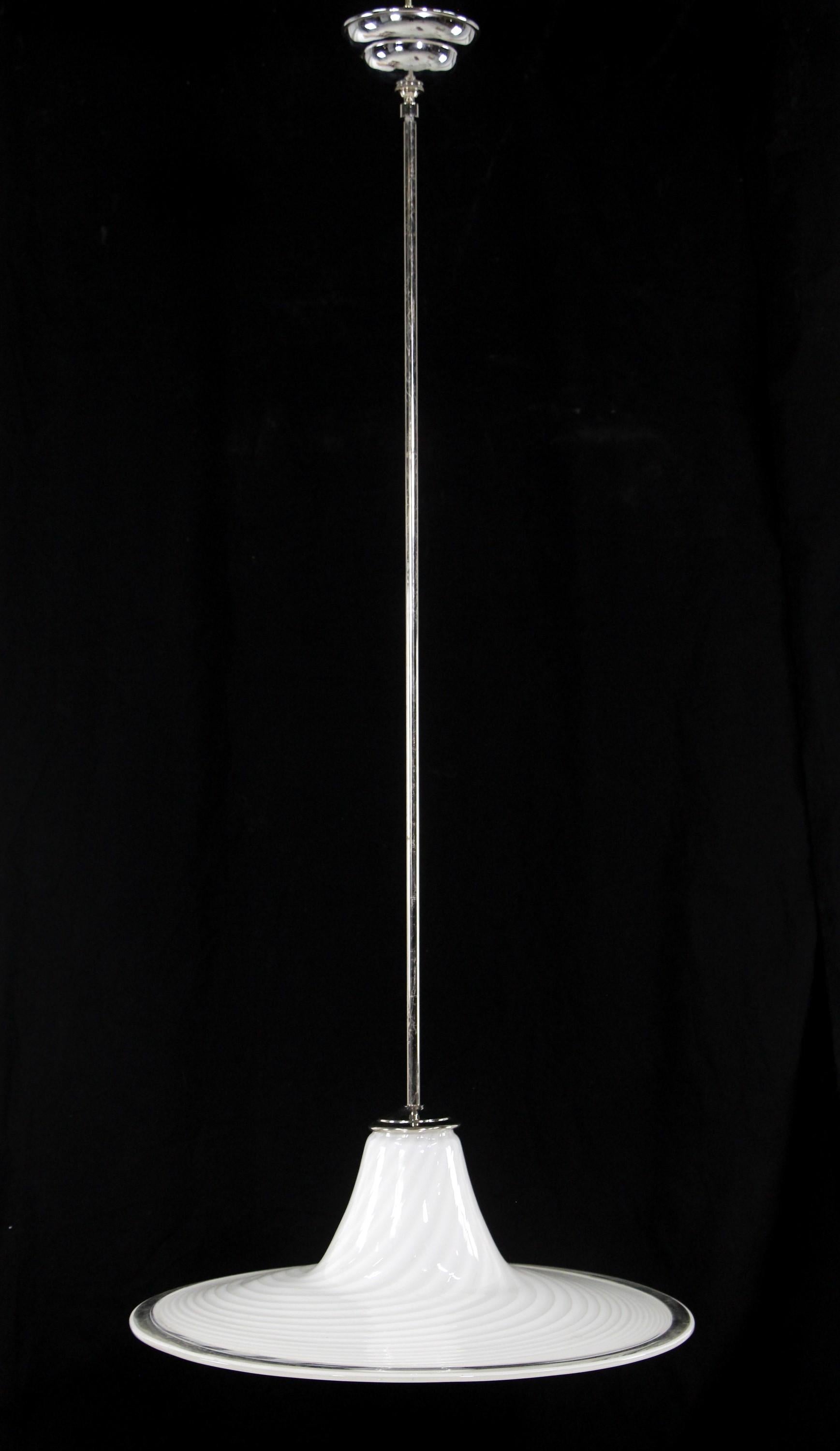 Late 20th Century white and clear Vetri Murano Italian hand formed glass pendant light featuring subtle swirls. Updated with new polished nickel plated brass pole and canopy. Newly rewired. This can be seen at our 400 Gilligan St location in