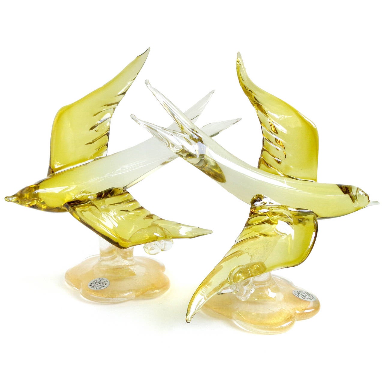 Beautiful rare set of vintage Murano hand blown olive yellow and gold flecks Italian art glass swallow bird sculptures. Attributed to designer Alfredo Barbini, circa 1950s. Captured in mid-flight! They have original 