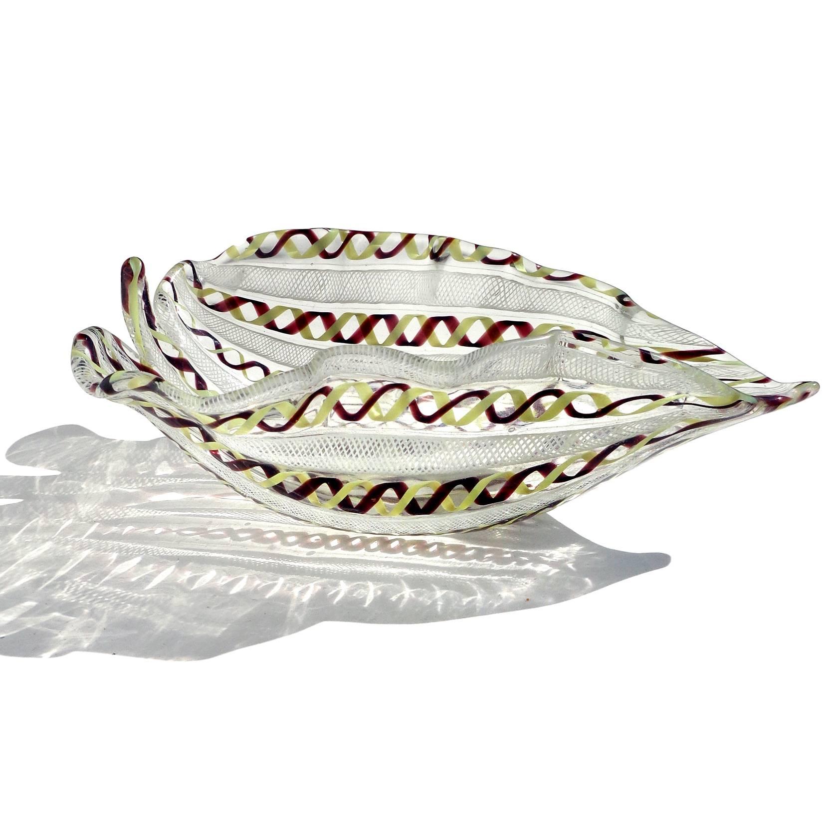 Gorgeous vintage Murano hand blown white, yellow and purple twisted Zanfirico ribbons Italian art glass leaf shaped bowl. Created in the manner of the Venini and Aureliano Toso companies. Would make a great display piece on any table. Use it as a