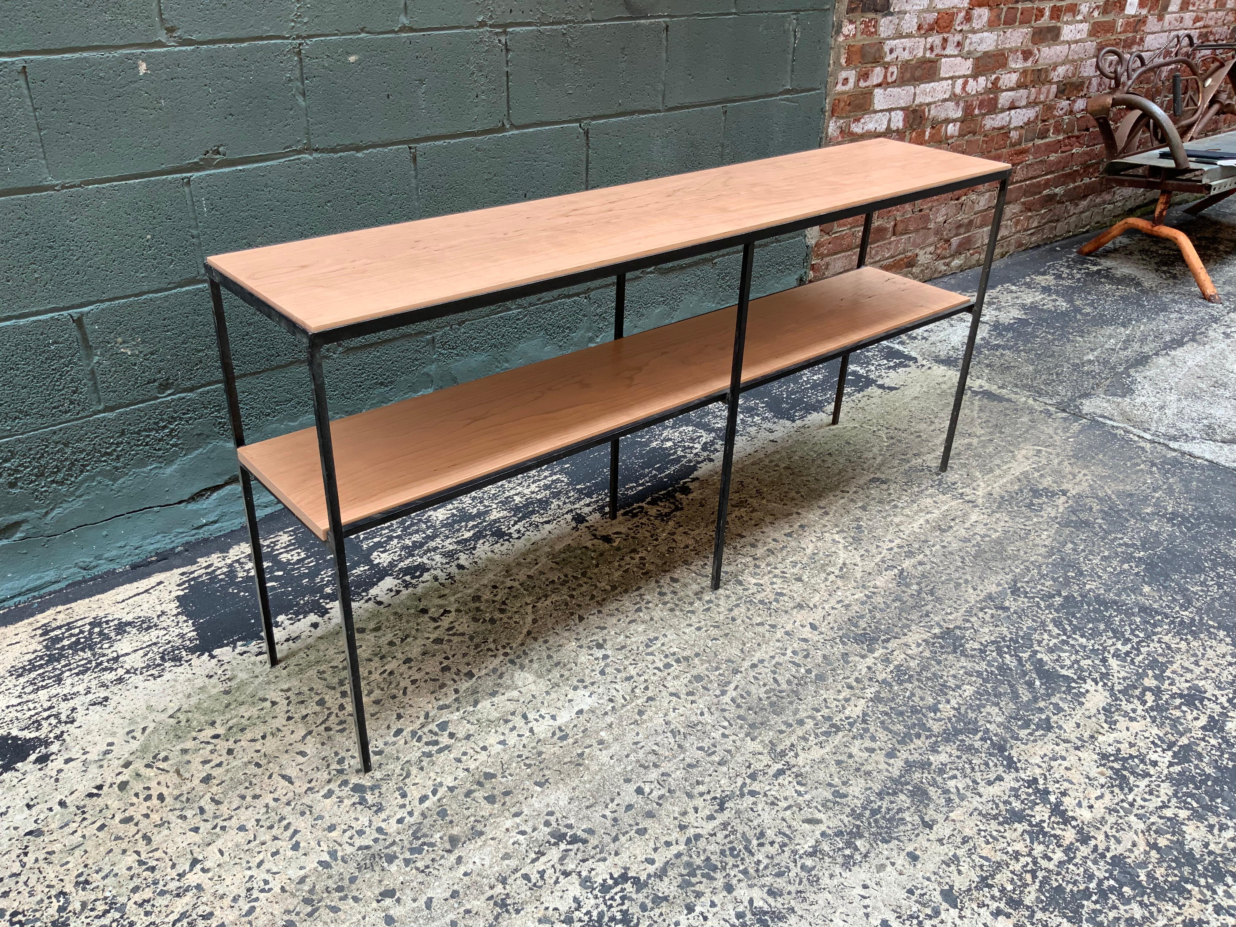 Free standing square iron rod with solid cherry shelving or room divider in the manner of Muriel Coleman for Pacific Iron or Vista. Beautiful grain in a natural finish, circa 1950-1960.

Measures: 13