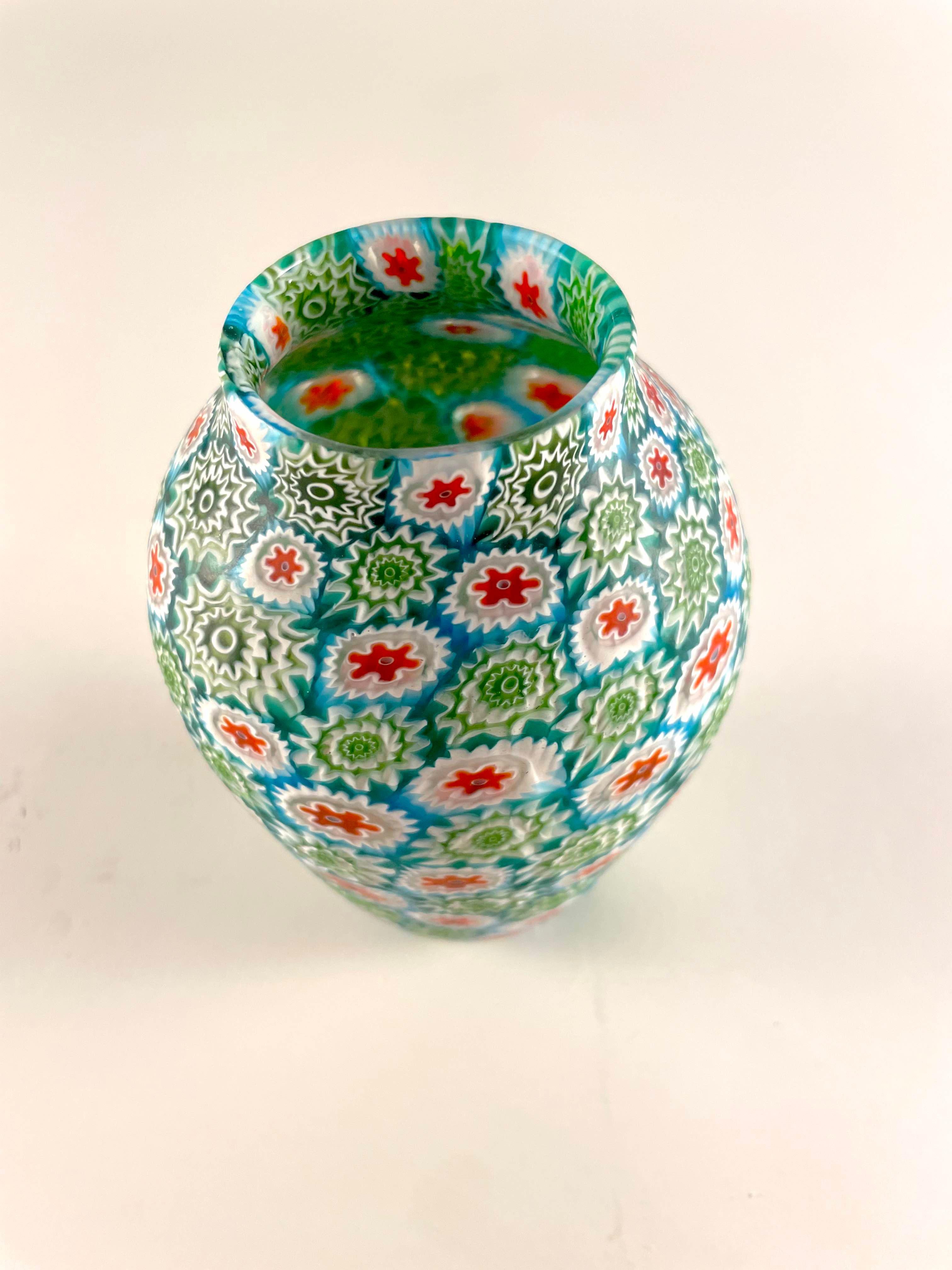 Millefiori Murrina vase by Fratelli Toso. This classic design hails from the '50s and showcases the true craftsmanship that made Fratelli Toso famous. Each piece is meticulously crafted using the murrina technique, making it a collectible vintage