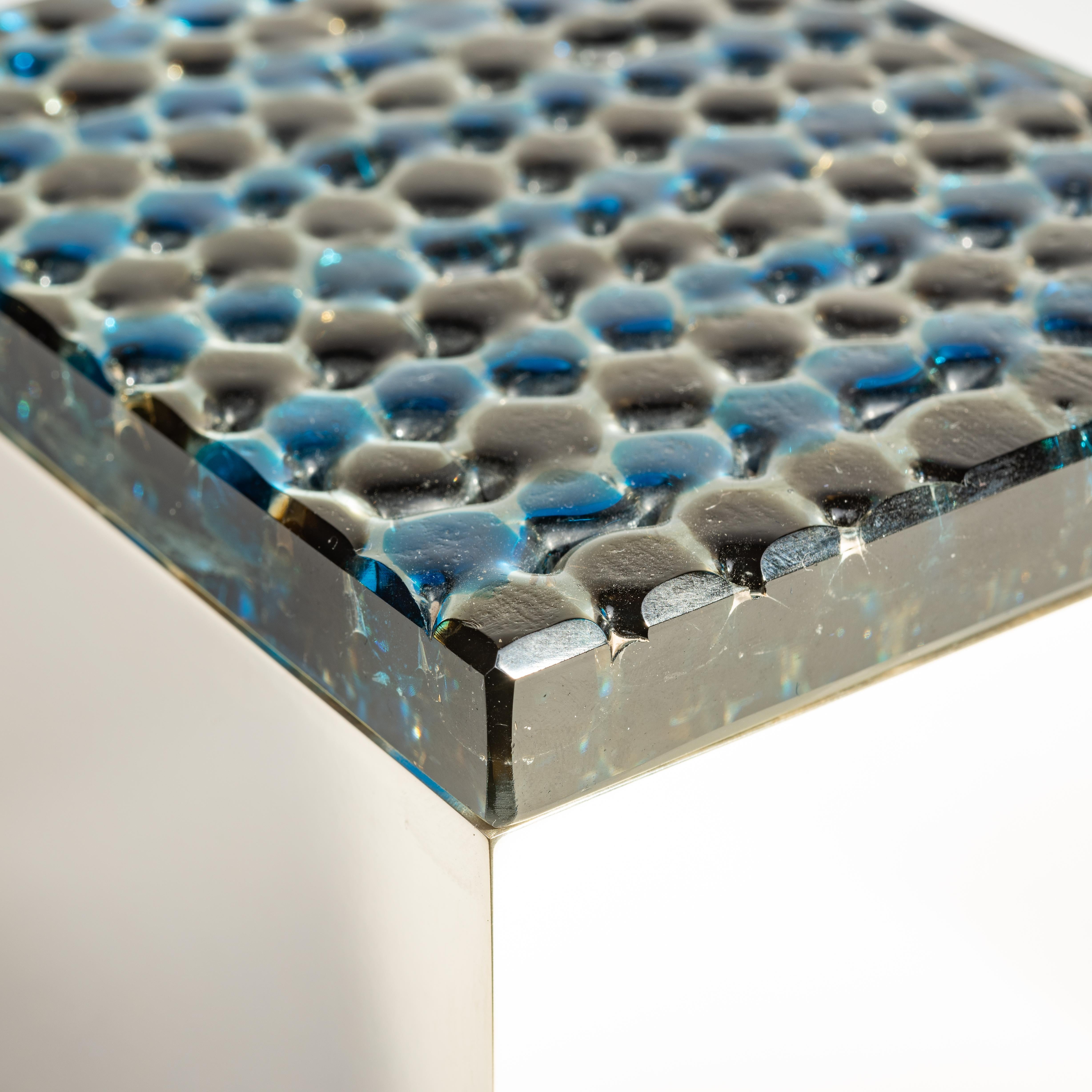 This vibrant blue and grayish green murine box seemingly holds the liquid tension of colors about to blend into one another, suspended in glass. Murrine or vetro mosaico is cut from a pre-prepared glass cane, whose pattern is created by the careful