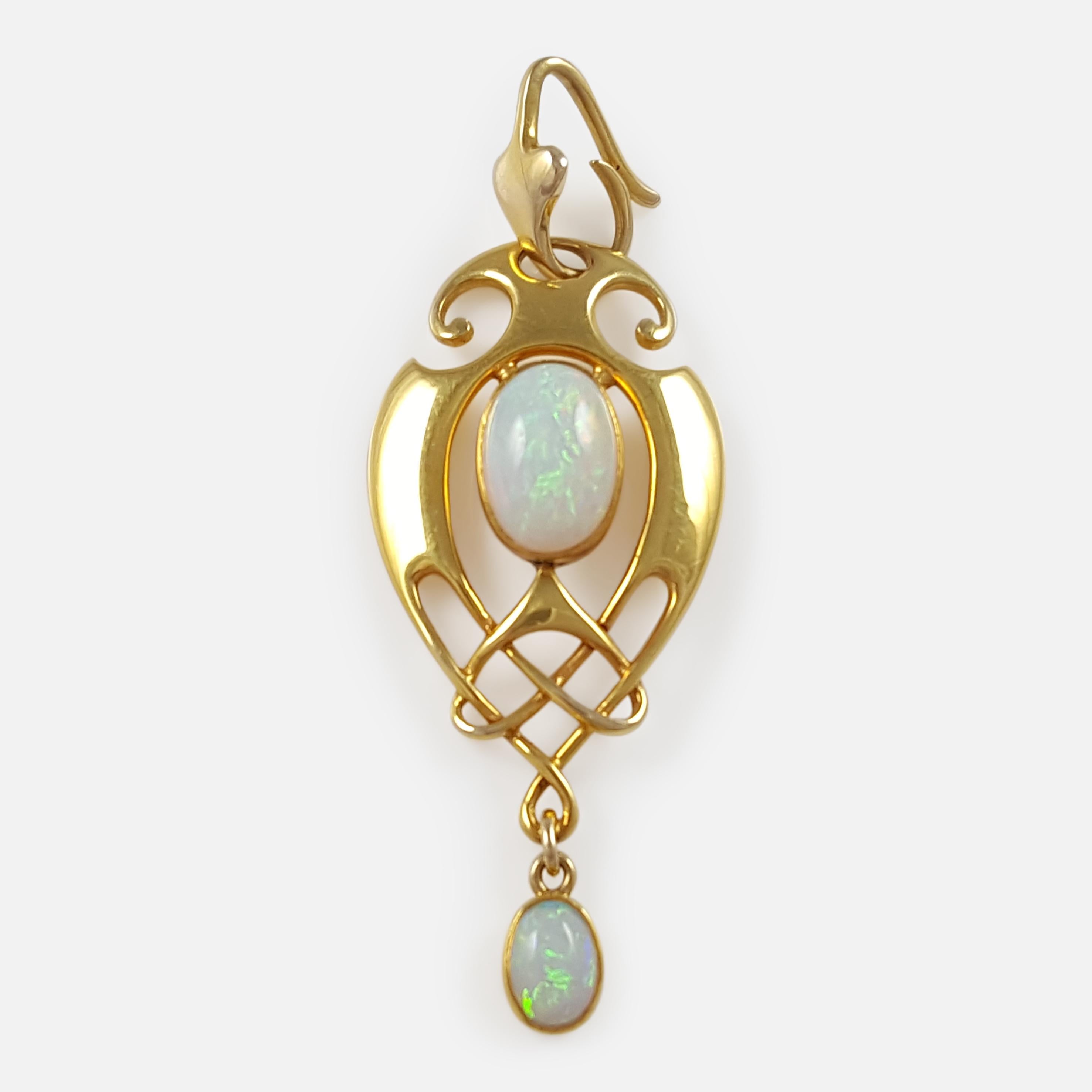 This is a fine antique Art Nouveau Murrle Bennett & Co Celtic Revival 15ct yellow gold & opal cabochon pendant, circa 1905. The pendant is designed in the Celtic revival style. The two opal cabochons are in good condition. The pendant is stamped to