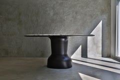Musa, a sculptural table with top in marble  150