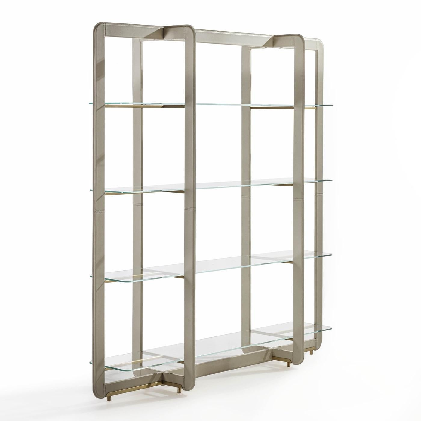 Intersecting elements arranged in impeccable harmony define the airy and dynamic silhouette of this bookcase, a superb design whose prized materials make it a plush accent in professional contexts or living rooms. The rectangular-cut, cylindrical