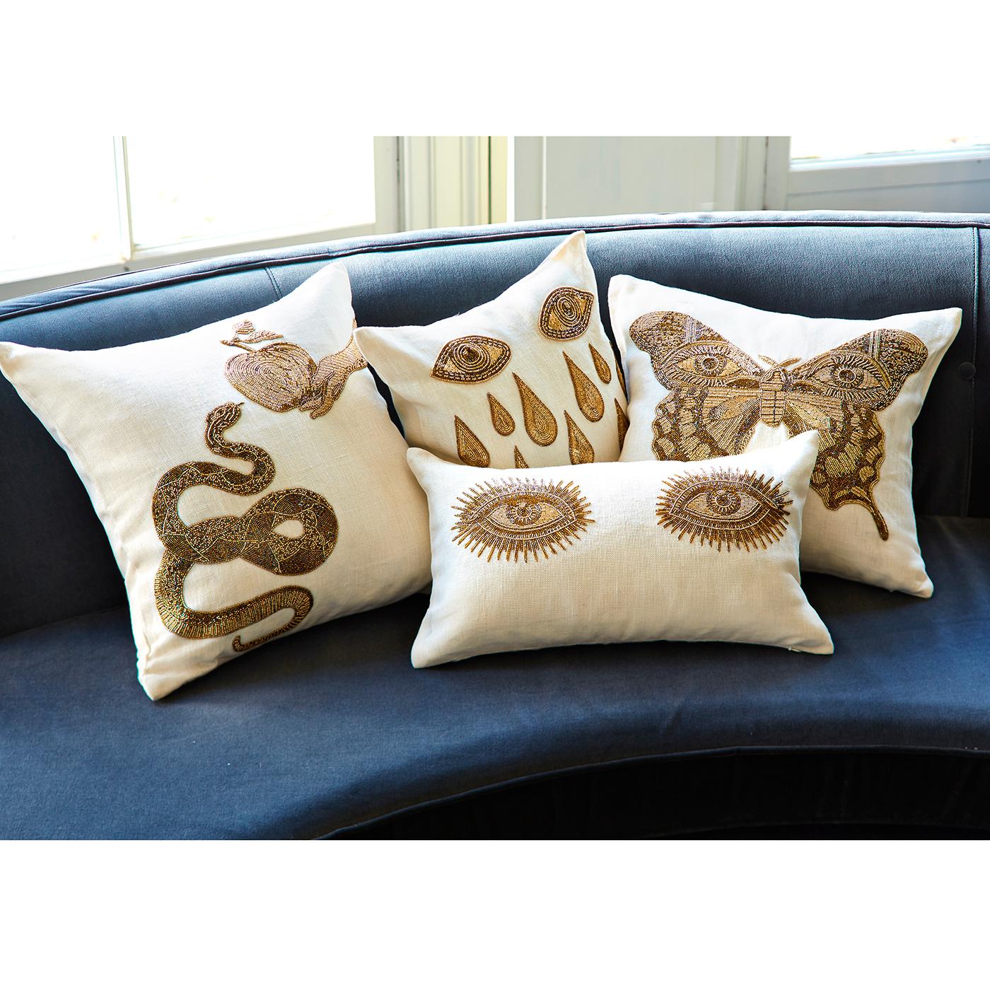 Surreal style. Handcrafted intricate gold beadwork embroidered on chunky ivory linen, our Muse Pillows are the perfect mix of the decadence of Halston and the madness of Dali. Crafty, couture, and exotic, these pillows will remind your guests