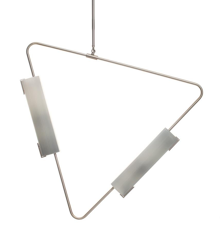 The Muse collection is comprised of triangular bent brass tube hardware with hand blown glass shades. Elements can be suspended in both horizontal and vertical orientations, combined into chandeliers or used individually.

Avram Rusu studio is a