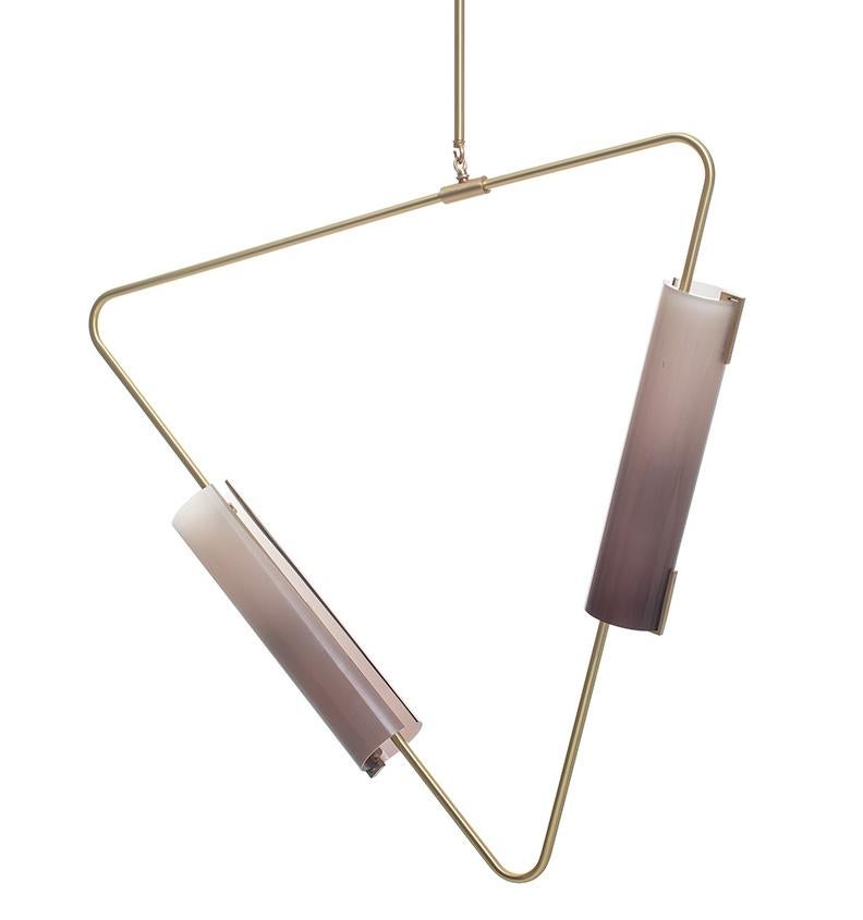 The Muse collection is comprised of triangular bent brass tube hardware with hand blown glass shades. Elements can be suspended in both horizontal and vertical orientations, combined into chandeliers or used individually. 

Avram Rusu Studio is a