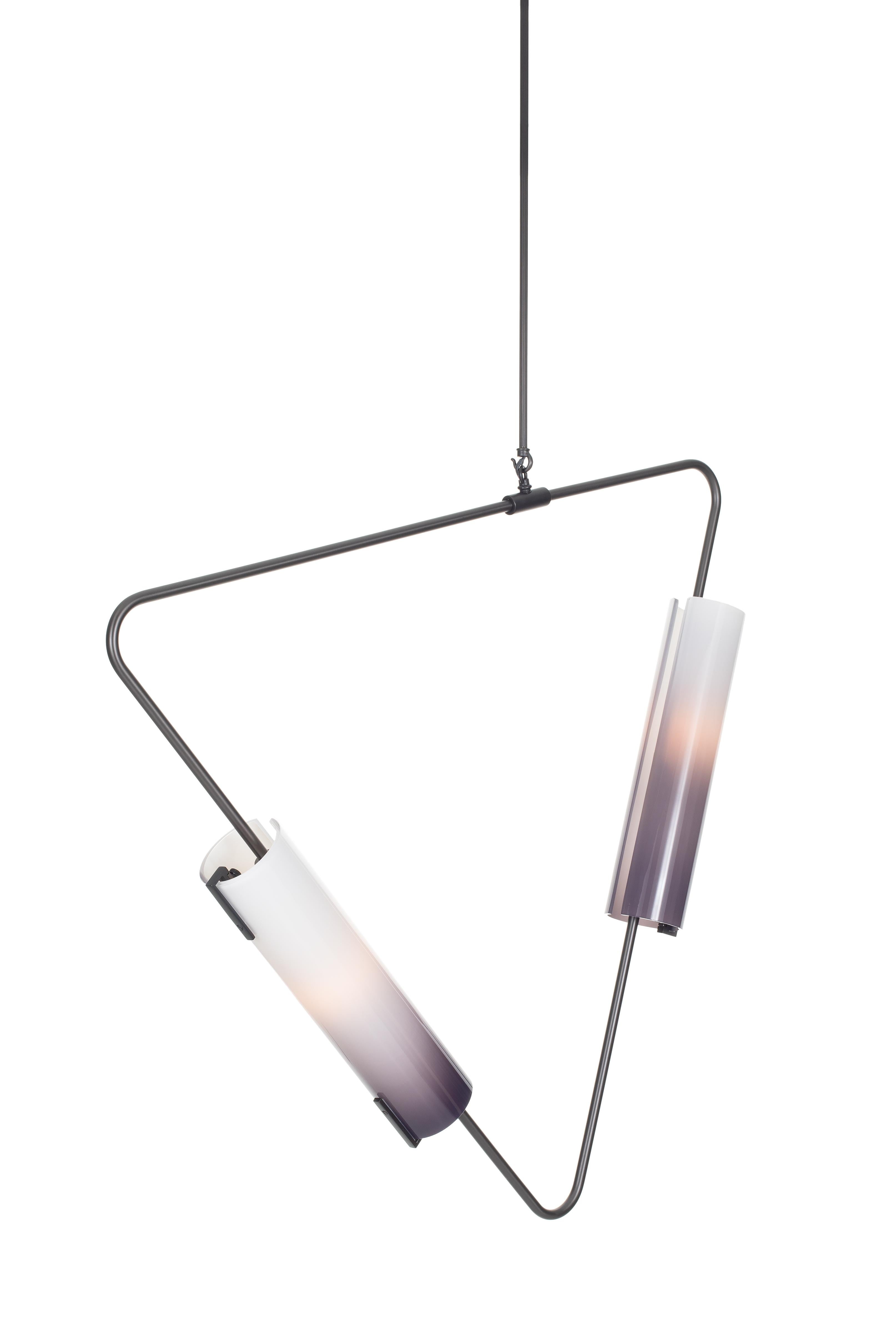 The Muse collection is comprised of triangular bent brass tube hardware with hand blown glass shades. Elements can be suspended in both horizontal and vertical orientations, combined into chandeliers or used individually. 

Avram Rusu Studio is a