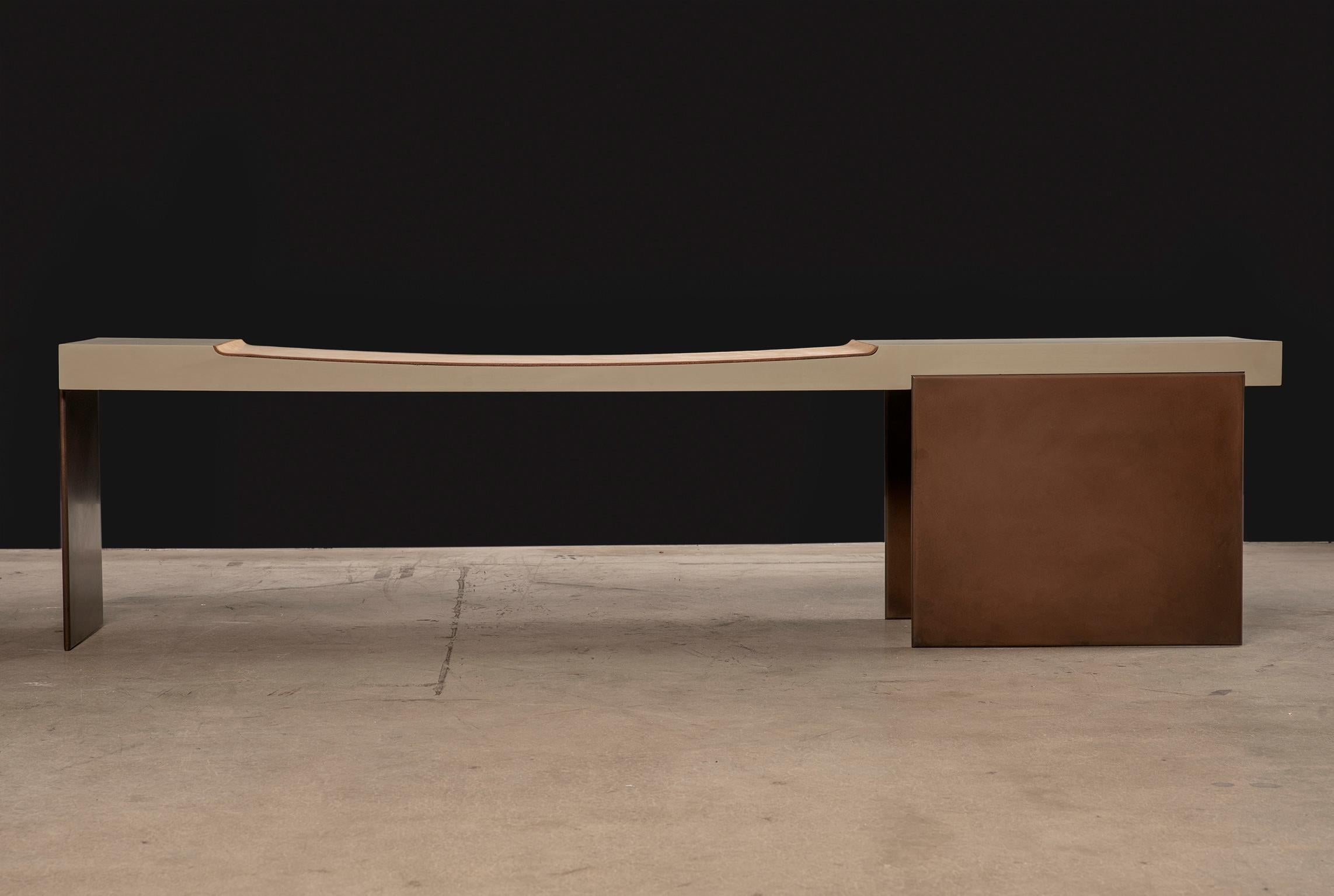 The Museum bench imparts a statement of quiet strength and elegance. Its contemporary Minimalist design is balanced with substantial materials, tones and textures. The solid wood body is coated in a matte celadon finish and has a carved seating