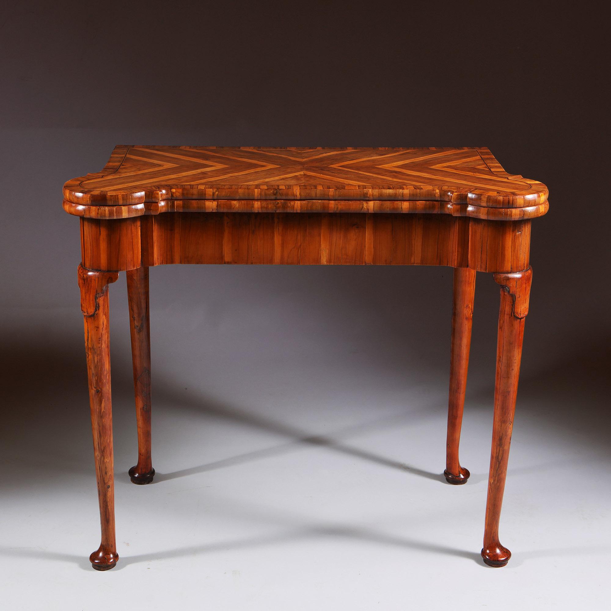 Museum Grade George I Cocus Wood Card Table (Partridge). -

English Circa 1725. The folding top with outset rounded corners and banded in quarter veneered parquetry top above a shaped frieze with hinged folding concertina action to the back legs to