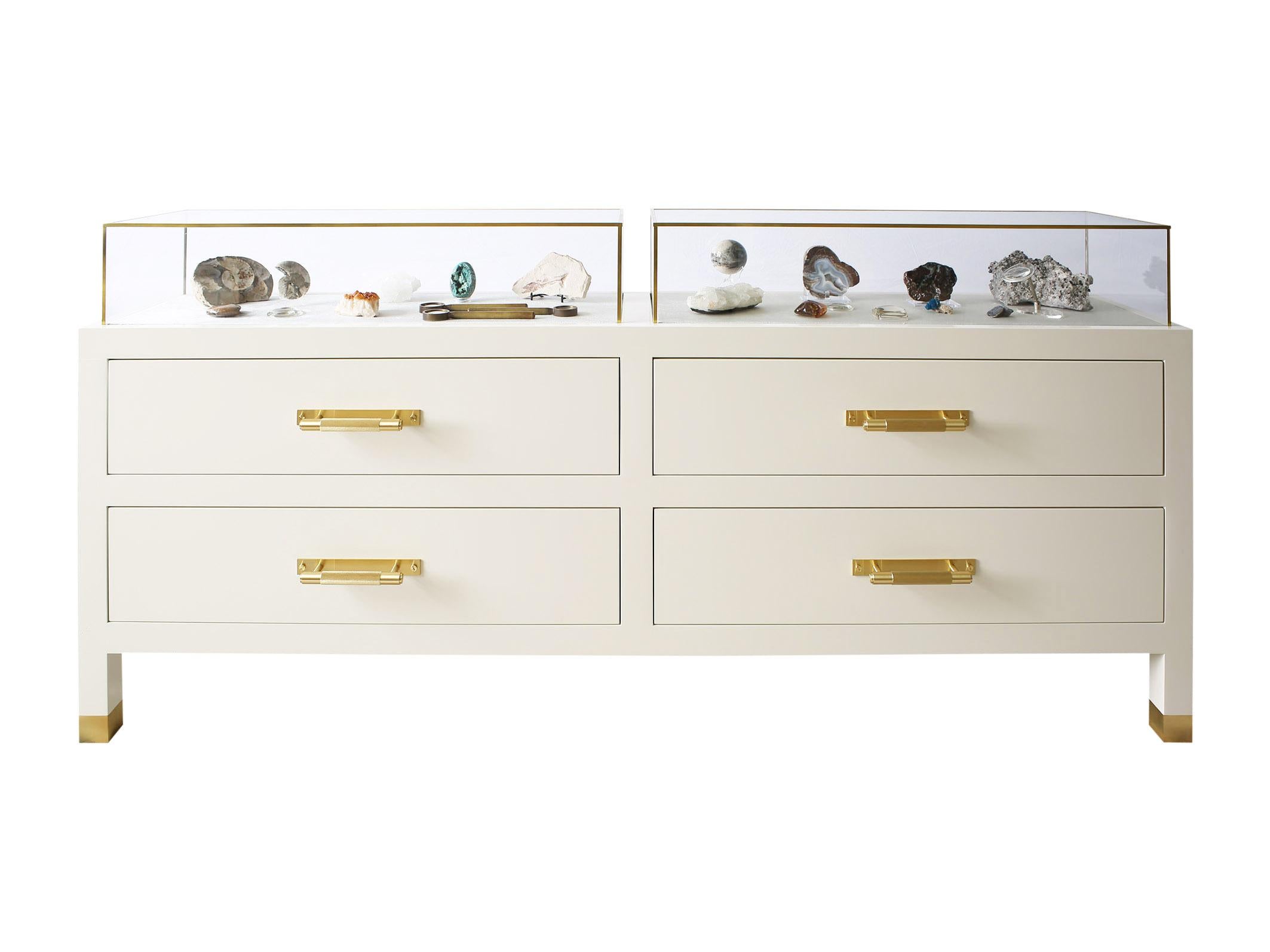 Lisa Tharp Collection  Museum Console

Inspired by museums, libraries and galleries worldwide, the Museum console showcases objects in clear display boxes lined with silky velvet. Drop-down drawer fronts maximize interior storage.

Ivory