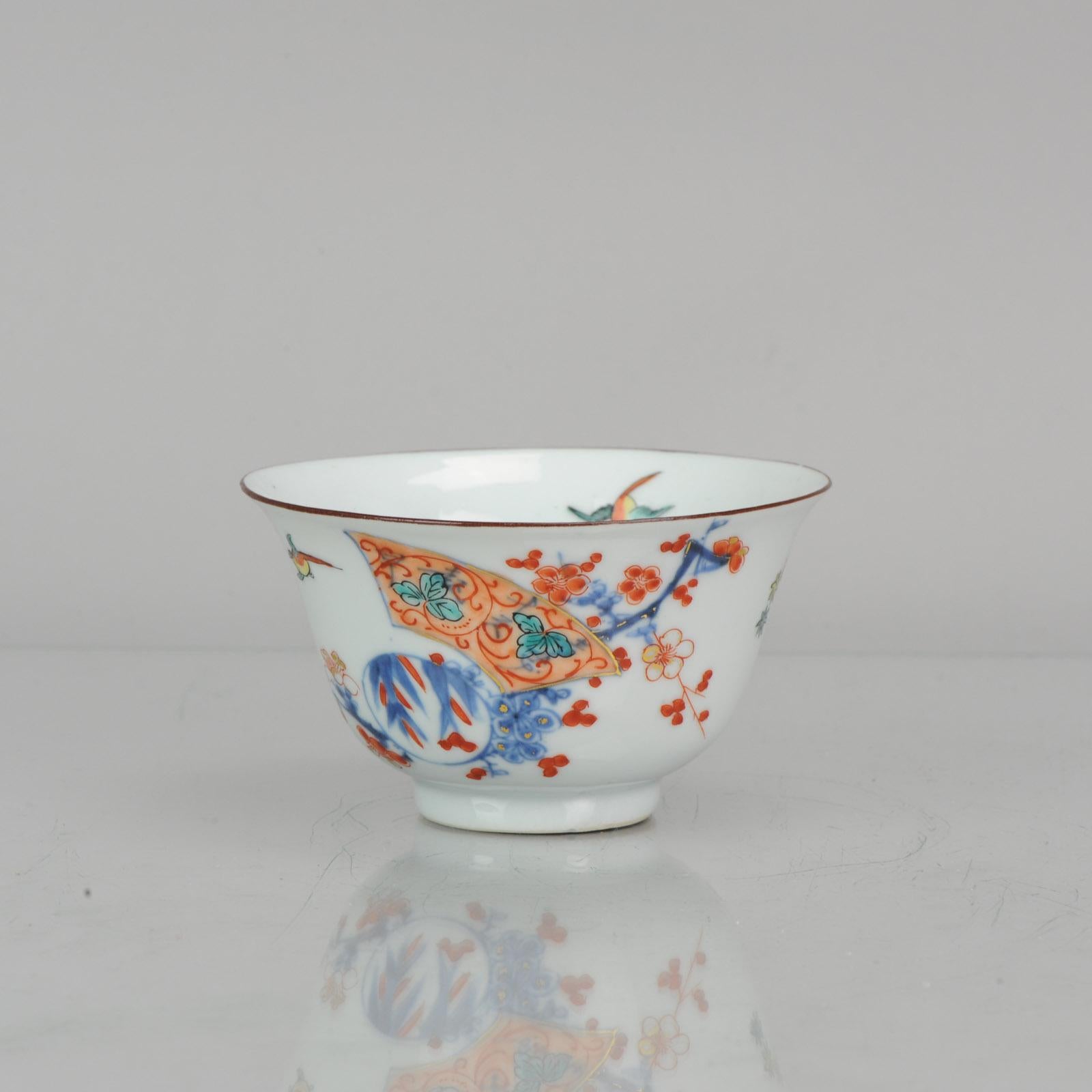 A Japanese Kakiemon-style bird-and-flower painting has been used here by a Dutch painter to decorate a Chinese porcelain bowl. The grouping of a pair of magpies, plum blossoms, and bamboo is a traditional Chinese image, which forms the rebus 