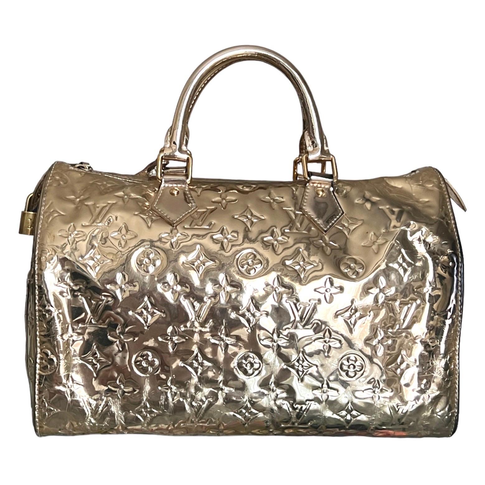 Limited Edition Louis Vuitton Monogram Miroir Monogram Speedy Bag
Designed by Marc Jacobs for Louis Vuitton's Fall 2006/2007 collection.
A true icon and sold out immediately in 2006.

A rare collector's piece and already part of the collection of