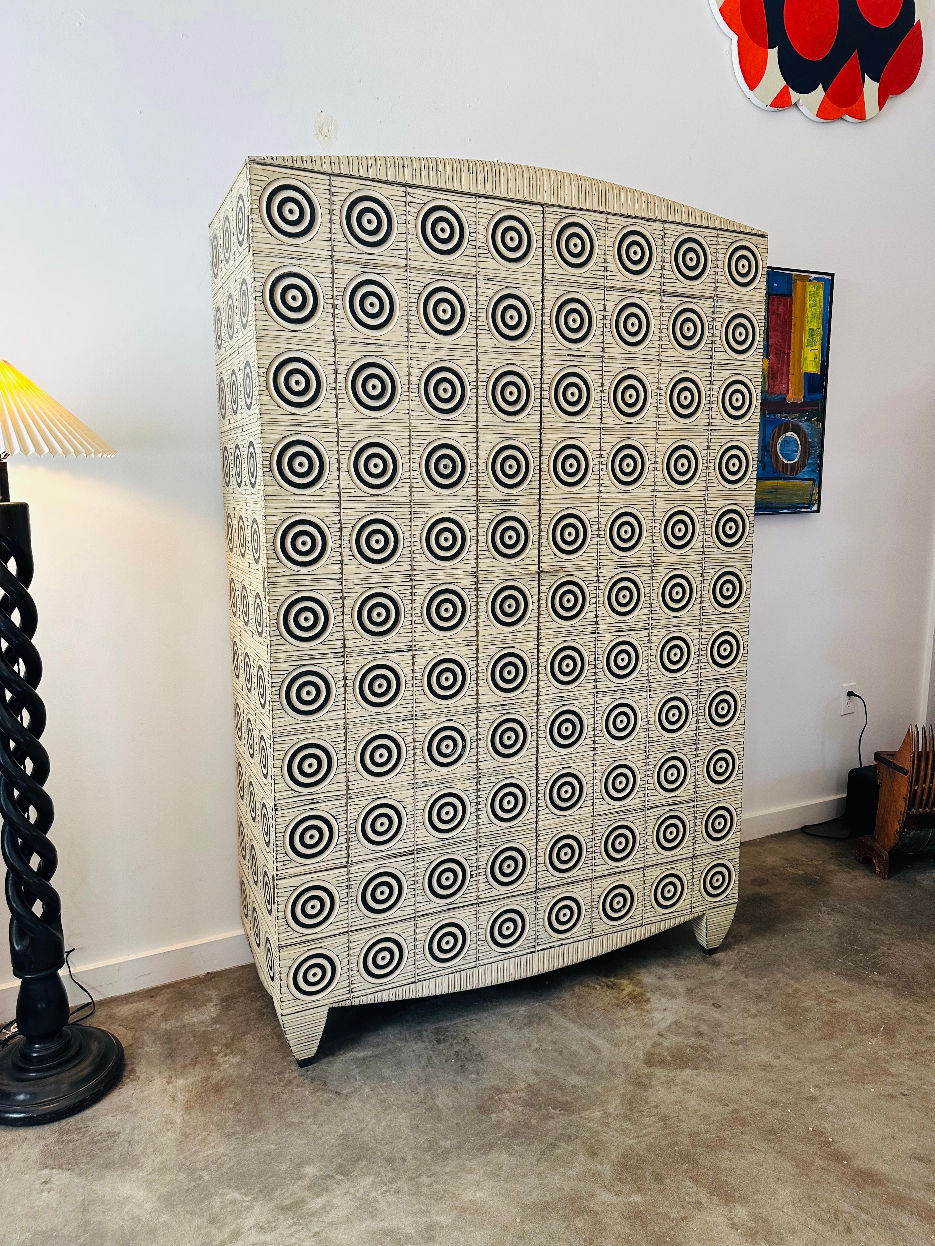 Incredible one-of-a-kind museum-quality carved armoire designed, built, and signed by esteemed artist, John Eric Byers, whose work has been in the collections of the Smithsonian, the Museum of Arts and Design, and more. The piece features 7 drawers,