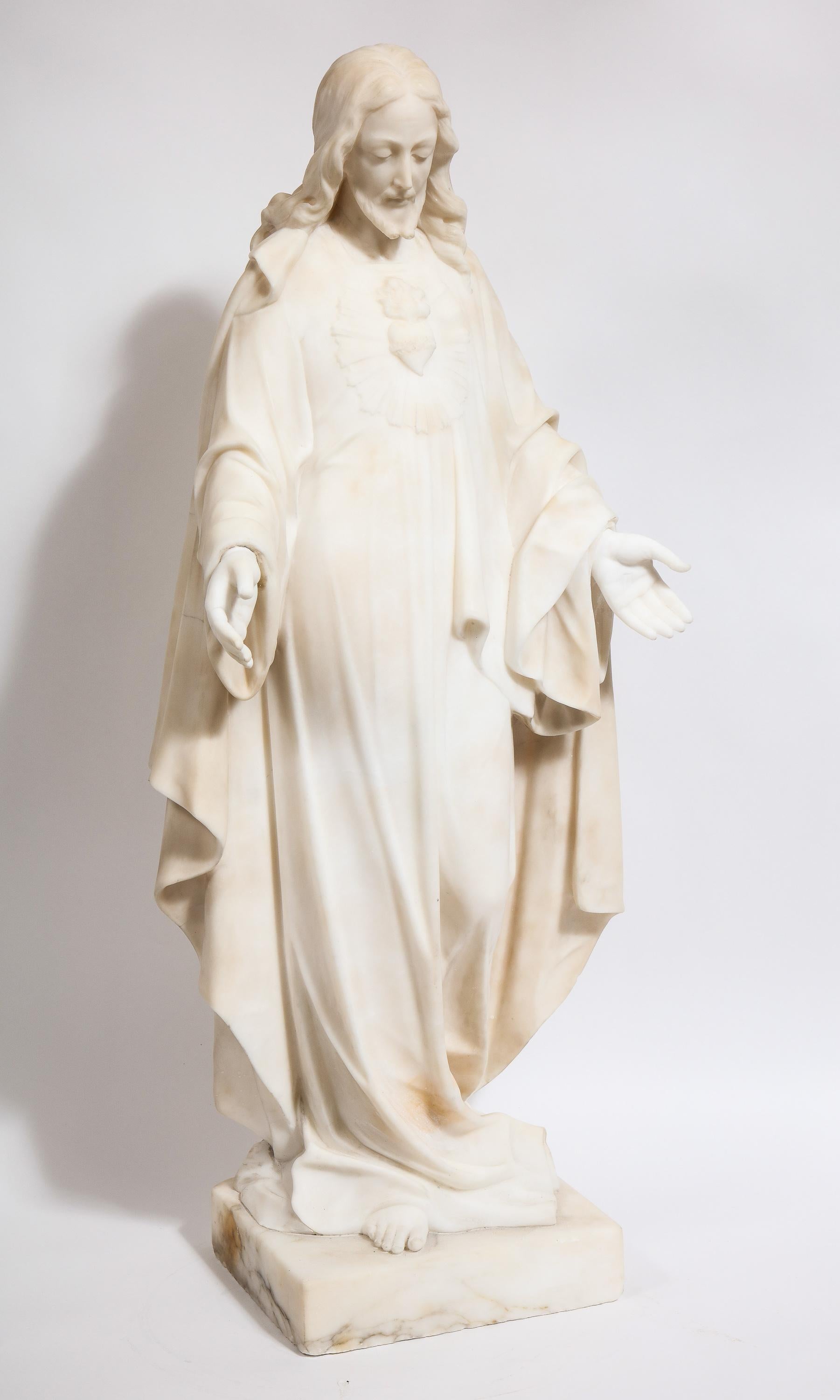 Museum quality Italian marble sculpture statue of Holy Jesus Christ, 19th century.

Exceptionally carved white-carrara marble sculpture depicting Jesus Christ standing with his palms open wearing his sacred heart. Rare marble from the 19th