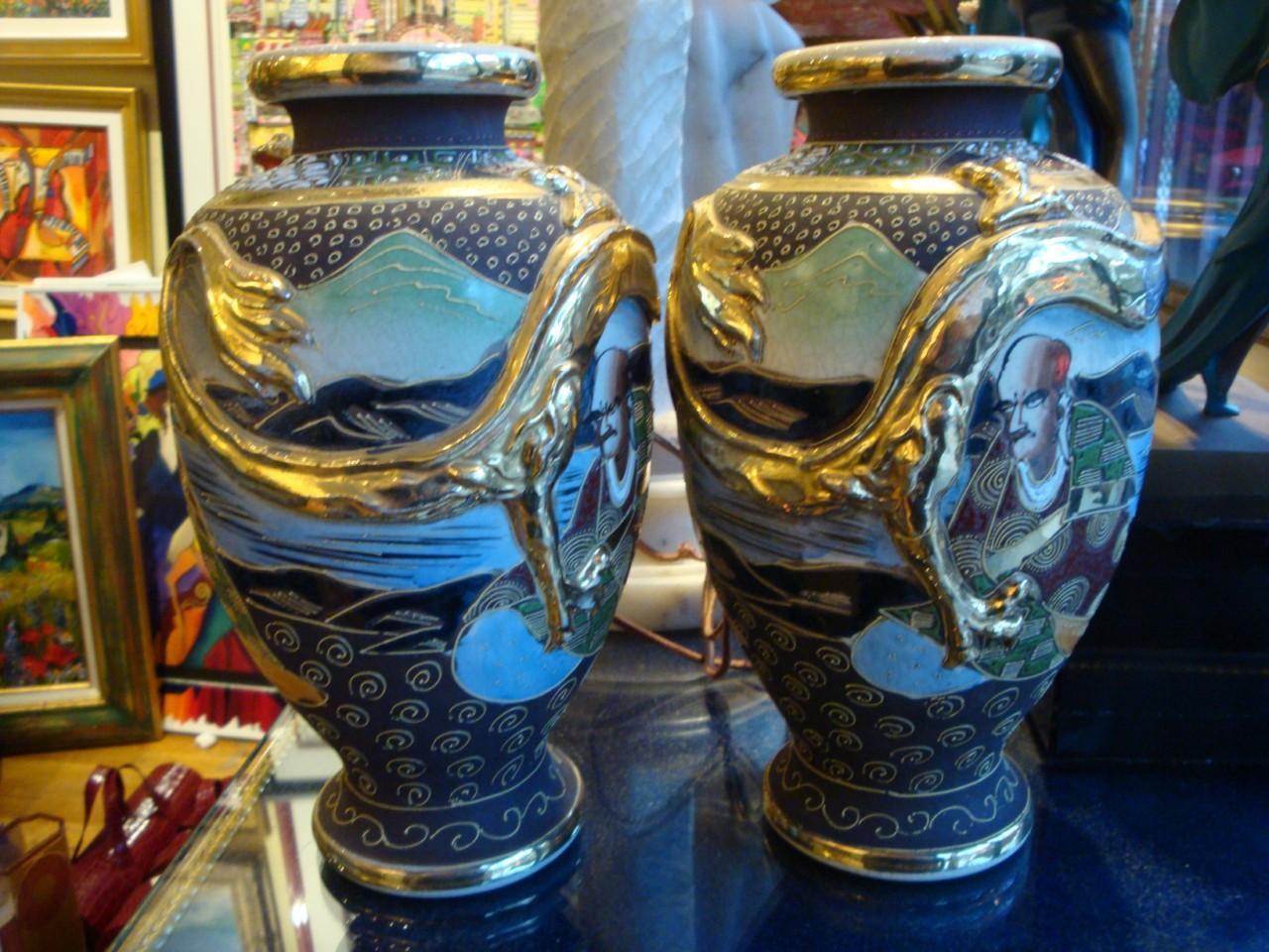 A BEAUTIFUL PAIR OF ANTIQUE HANDPAINTED SATSUMA POTTERY VASES. EACH BALUSTER WITH GILT AND ENAMEL PORTRAITS IN A LANDSCAPE DECORATION ON  A JEWELED BROWN GROUND WITH FIRED GOLD DRAGONS IN RELIEF & EMBOSSED , CIRCA 1910

PROVENANCE: TAKEN OUT OF AN