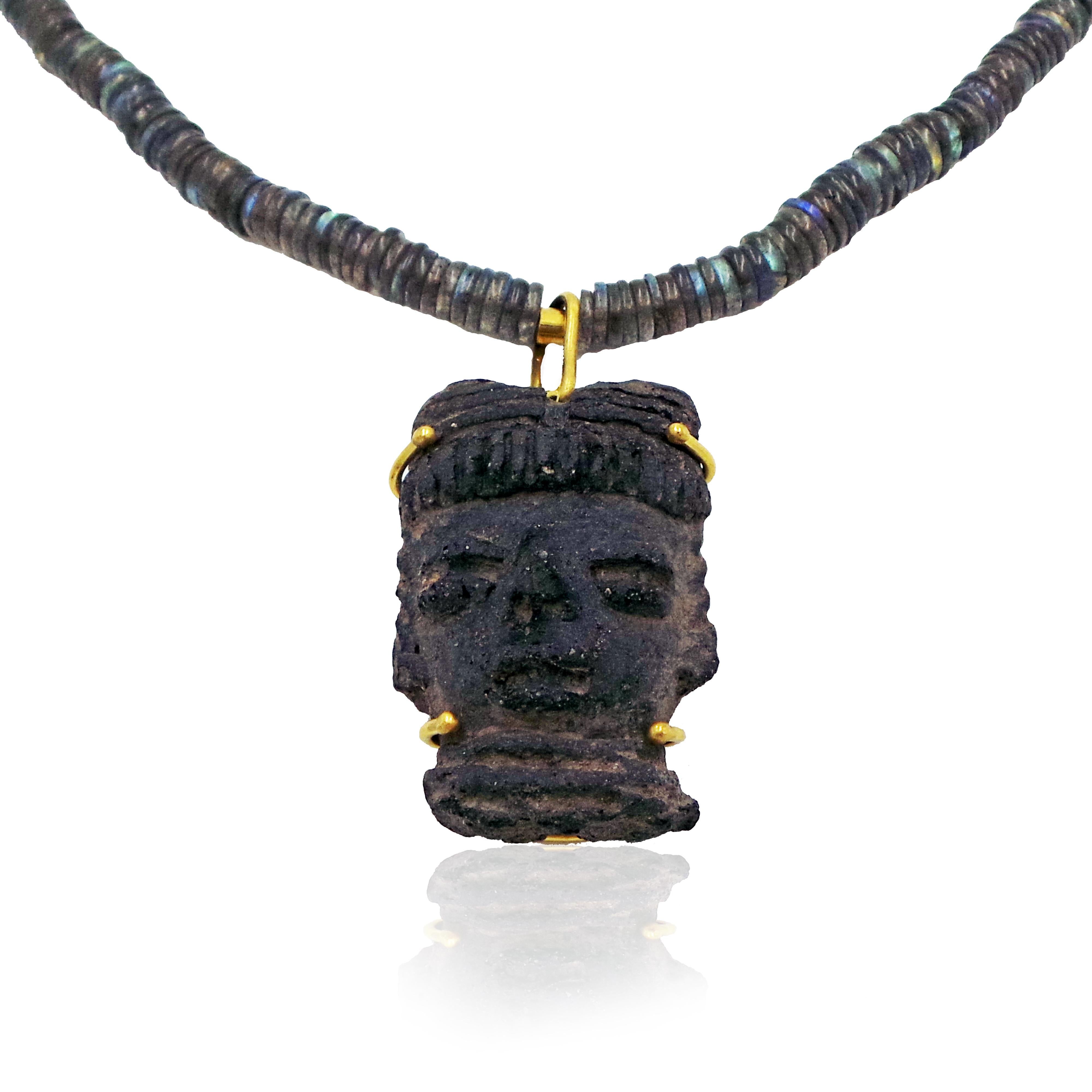 Pre-Columbian carved stone head artfact is set in 22k yellow gold, and fashioned with a hook-on bail for easy transfer to your other chains, leather cords or beaded/ strung necklaces. Carved stone pendant with hook bail is 2 inches or 51mm long.