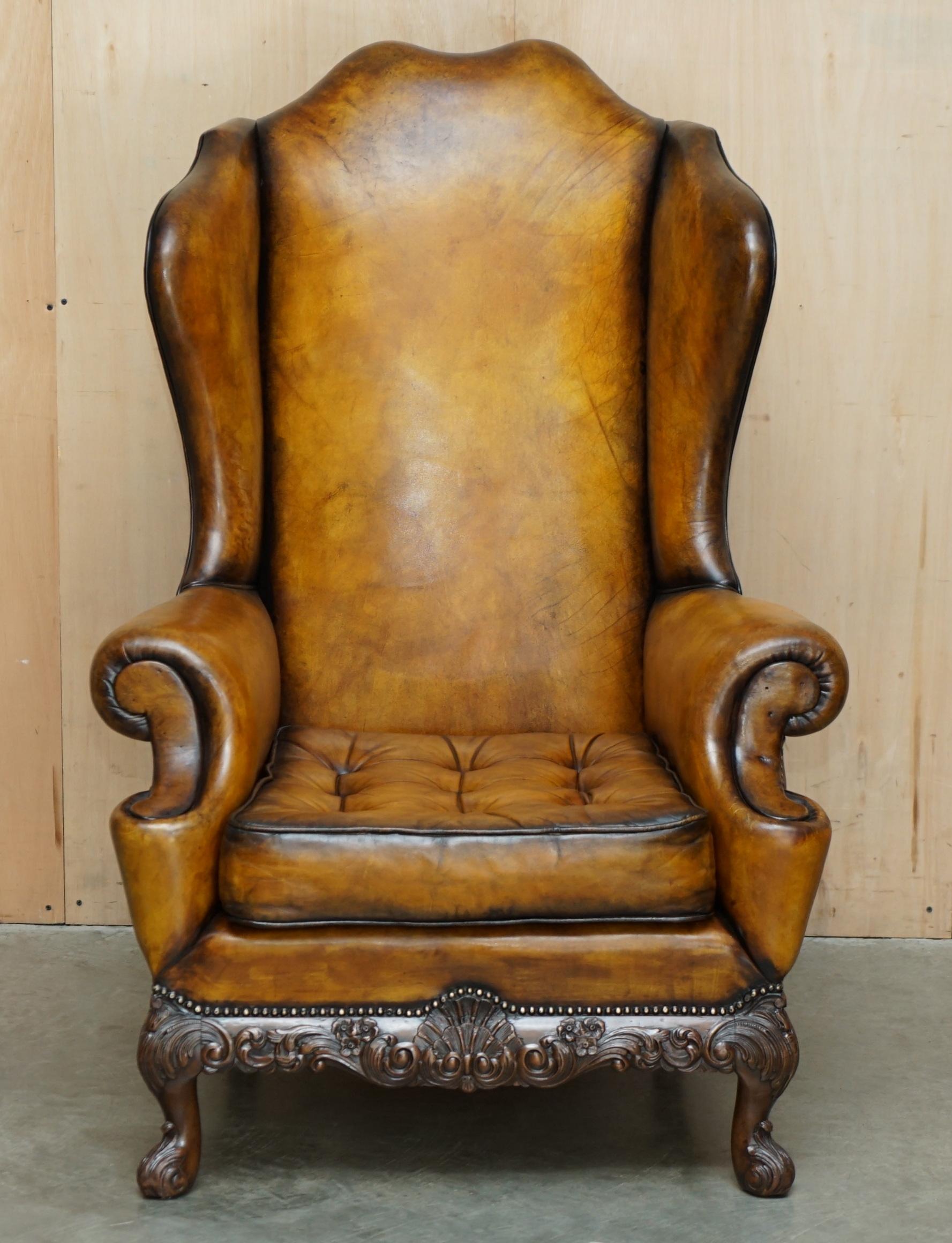 Royal House Antiques is delighted to offer for sale this absolutely sublime, Museum quality, fully restored, extra large Wingback armchair with ornately hand carved base frame and Thomas Chippendale floating button cushion 

Please note the delivery
