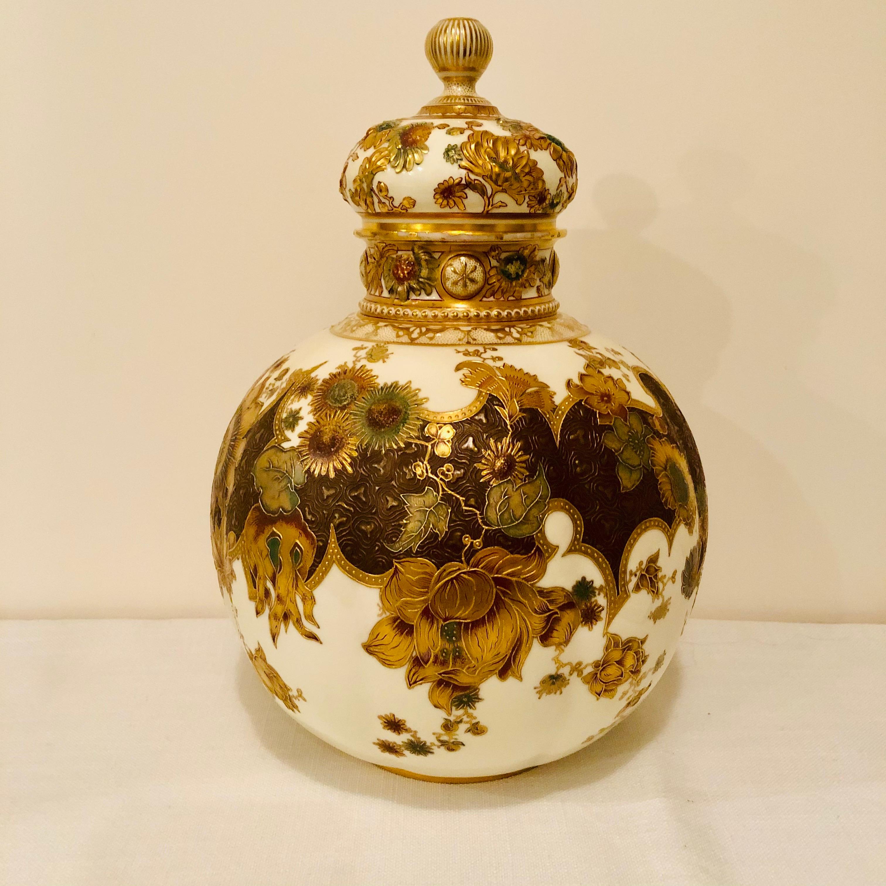 Look at this magnificent museum quality Royal Crown Derby urn. It is 12.75 inches tall, and it dates back to 1886. It is decorated on all sides with raised embellishments of gold and flowers. Even the cover has raised flower decorations. It would