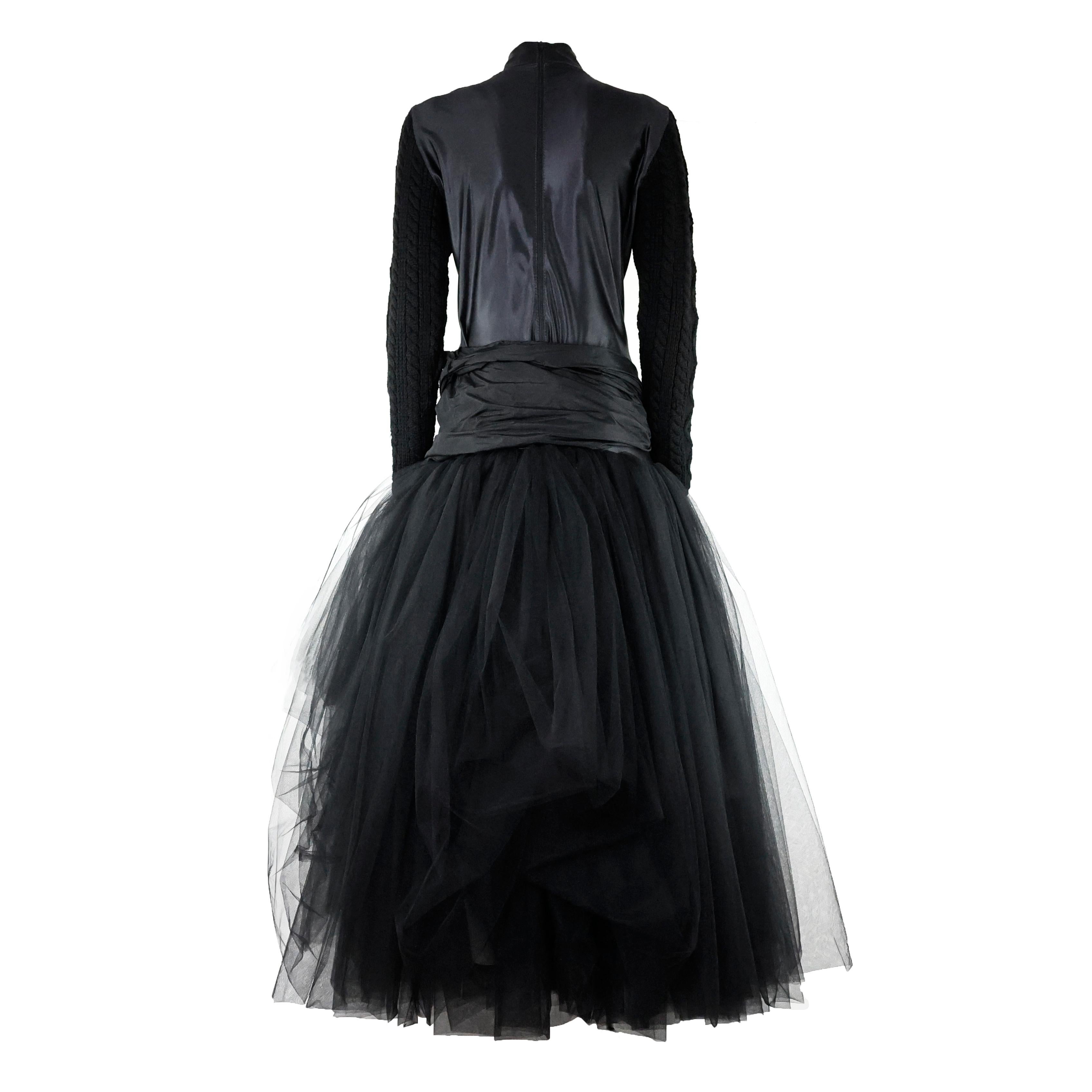 Museum-Worthy 1980s Jean Paul Gaultier Pour Equator Maxi black Dress in lycra, with silk bow, knitted sleeves and tulle skirt. Size 44 IT.

Condition:
Overall really good, some imperfections on tulle.

