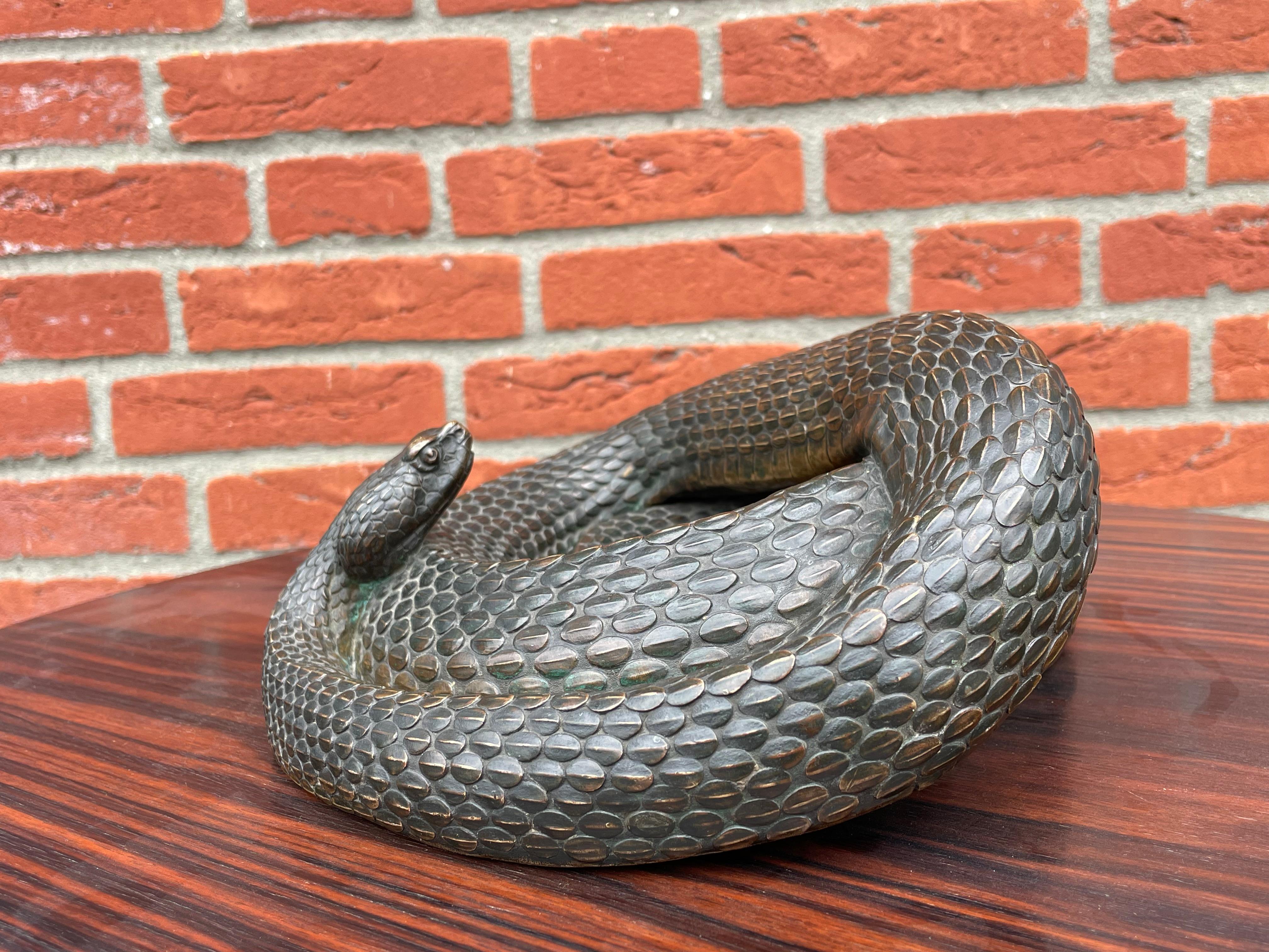 World class, aesthetically marvelous and extremely rare rattle snake culpture.

Over the decades we have sold some really good antique bronzes, but we feel that this diamondback rattler could very well be the rarest, the most detailed and the best