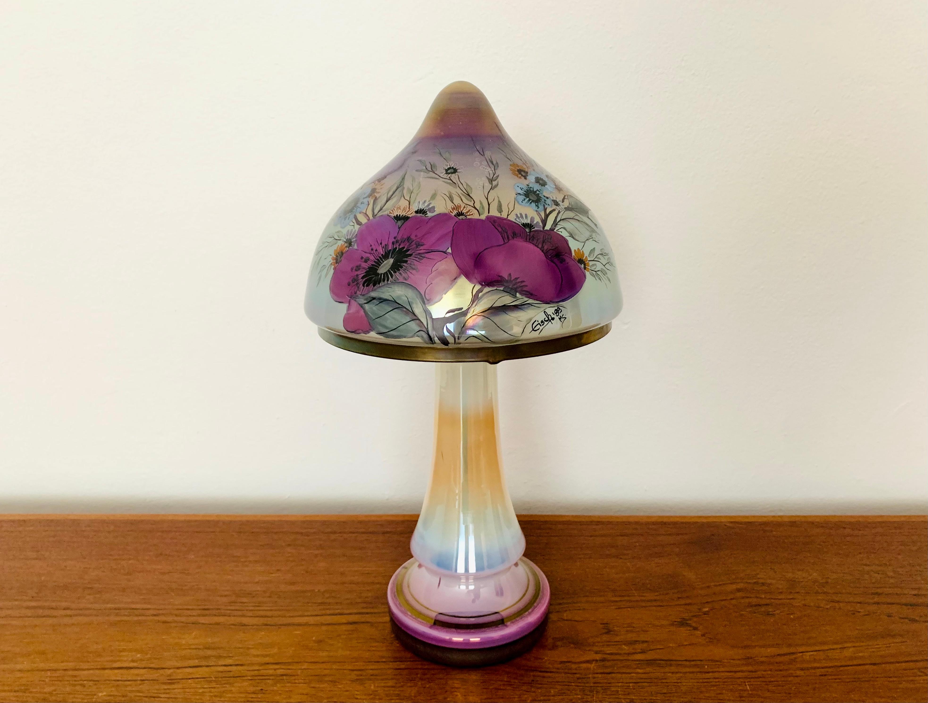 Very nice and high -quality hand -painted glass table lamp from the 1980s.
The lamp is very noble and a very special design object.
The glass and the colored painting create a very pleasant light.

Condition:

Very good vintage condition with slight