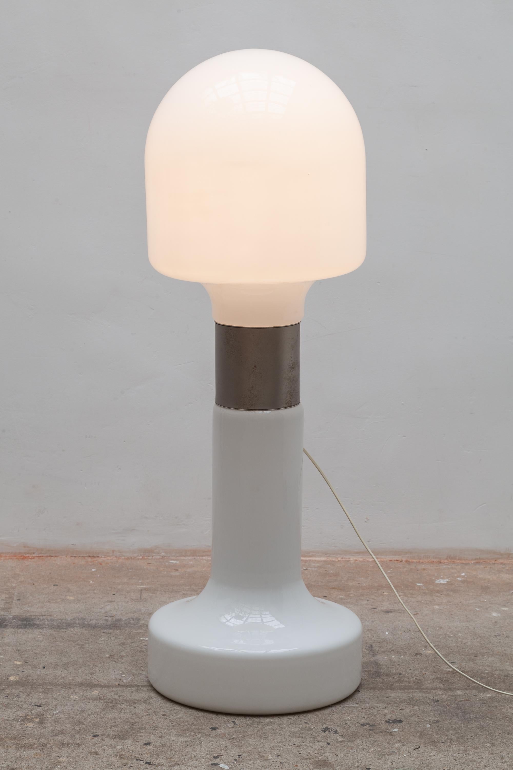 Italian design by Carlo Nason 1963 floor lamp.Milk glass mushroom shape with brushed chrome accents. The top and bottom shades can be lit up separately.
  