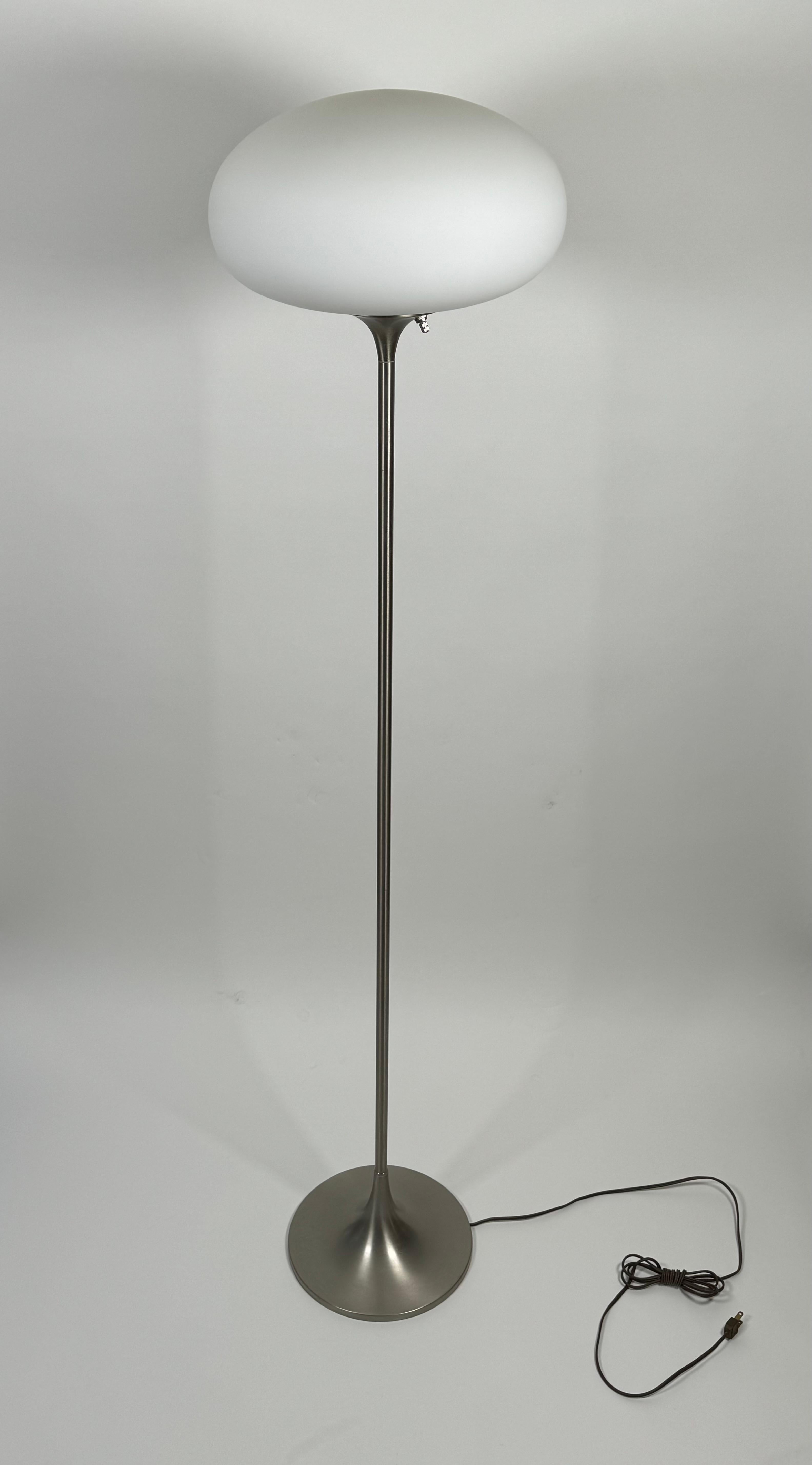 Mushroom Laurel floor lamp in a brushed chrome finish with a tulip base. The graceful form creates a soft light from it's frosted shade.