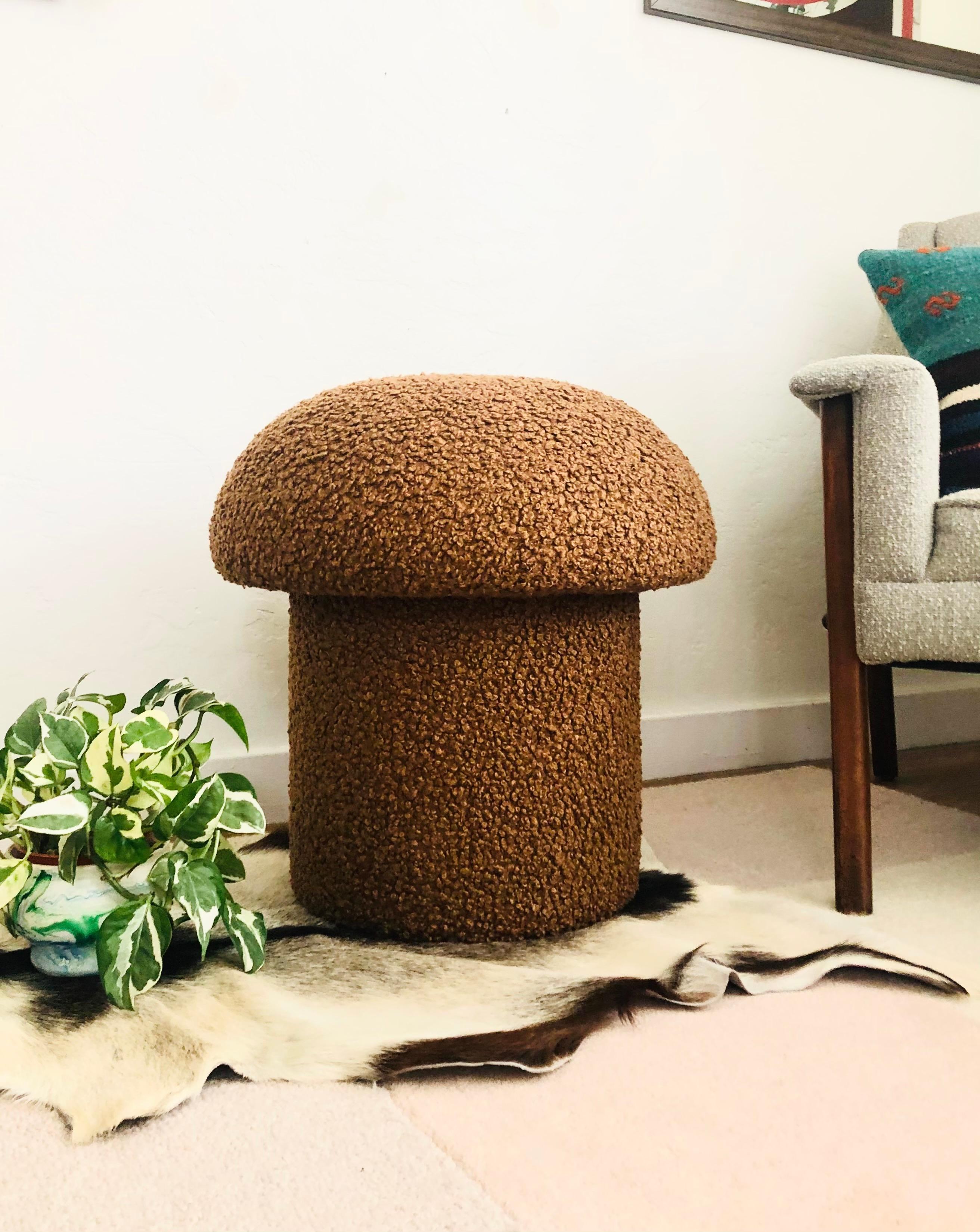 A handmade mushroom shaped ottoman, upholstered in a chestnut brown colored curly boucle fabric. Perfect for using as a footstool or extra occasional seating. A comfortable cushioned seat and sculptural accent piece.
Mushroom ottomans are made to