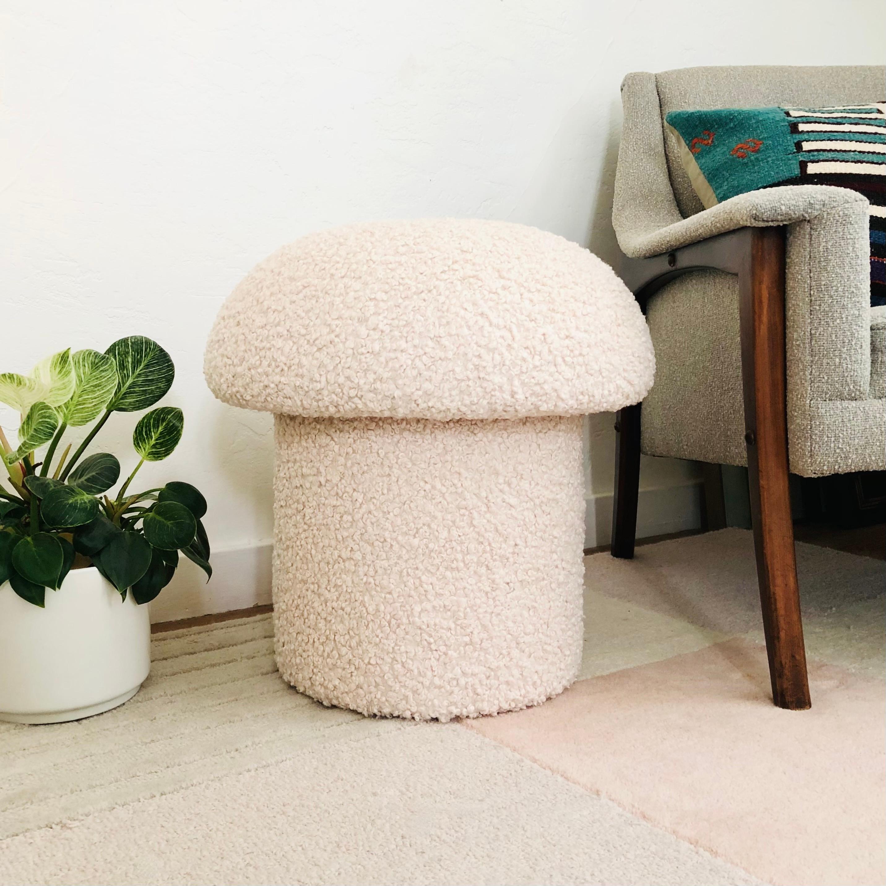 A handmade mushroom shaped stool, upholstered in a white colored curly boucle fabric. Perfect for using as a footstool or extra occasional seating. A comfortable cushioned seat and sculptural accent piece.
Mushroom ottomans are made to order,
