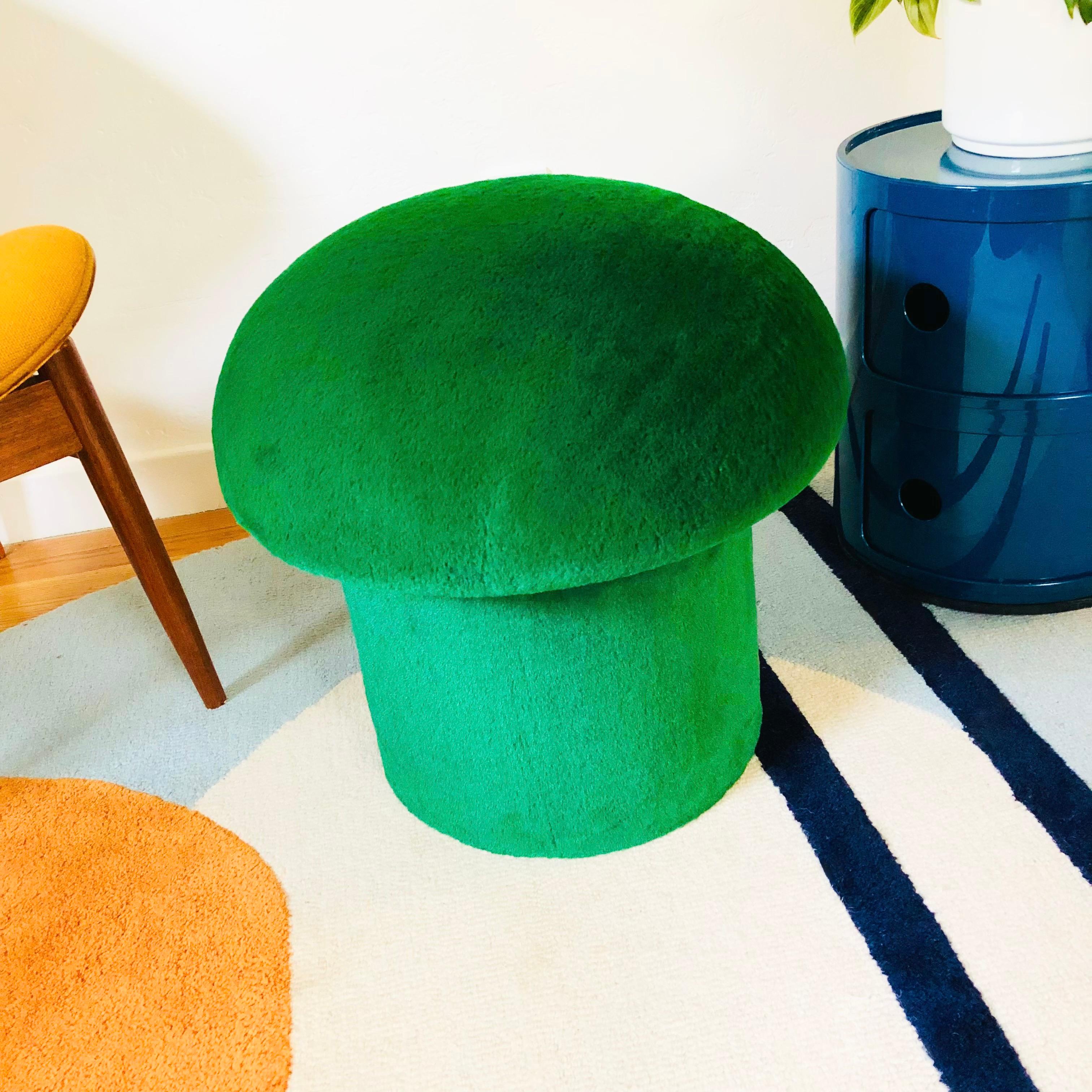 A handmade mushroom shaped ottoman, upholstered in an emerald colored high pile plush fabric. Perfect for using as a footstool or extra occasional seating. A comfortable cushioned seat and sculptural accent piece.
PLEASE NOTE:
Color variations may