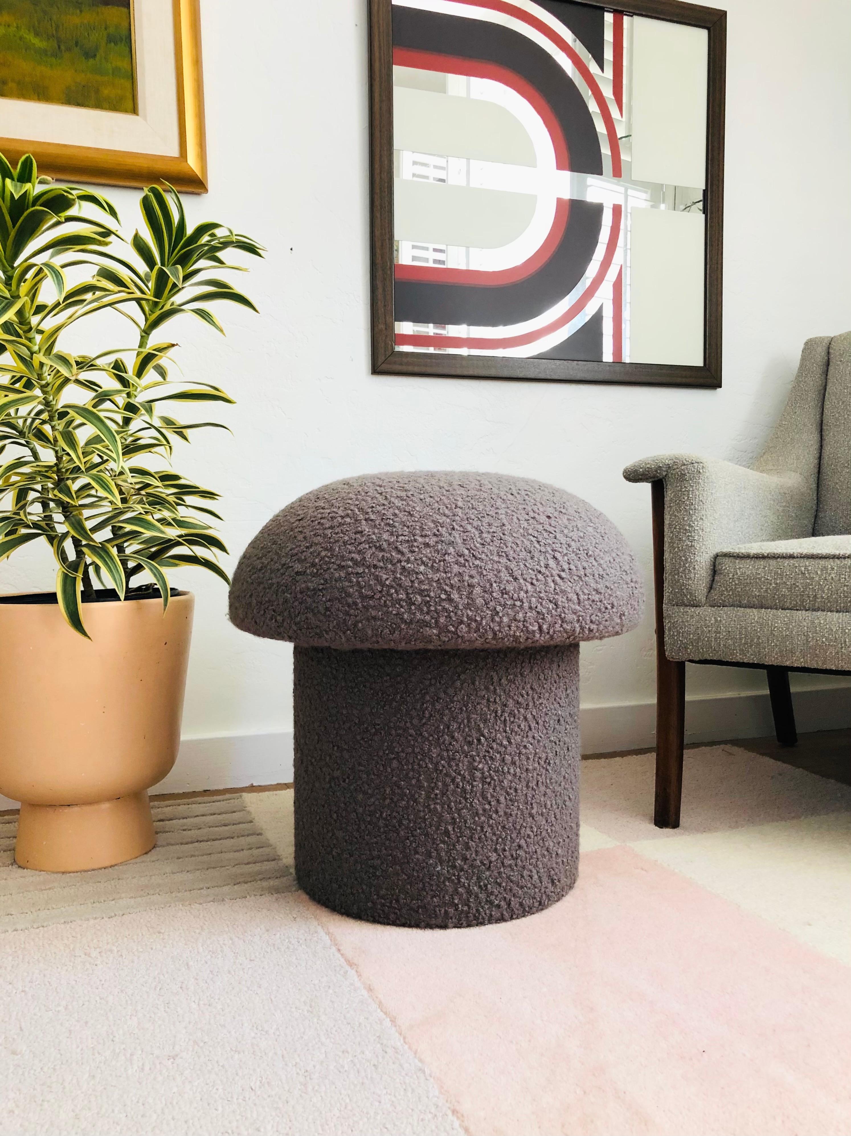 A handmade mushroom shaped ottoman, upholstered in a gray curly boucle fabric. Perfect for using as a footstool or extra occasional seating. A comfortable cushioned seat and sculptural accent piece.
Mushroom ottomans are made to order,