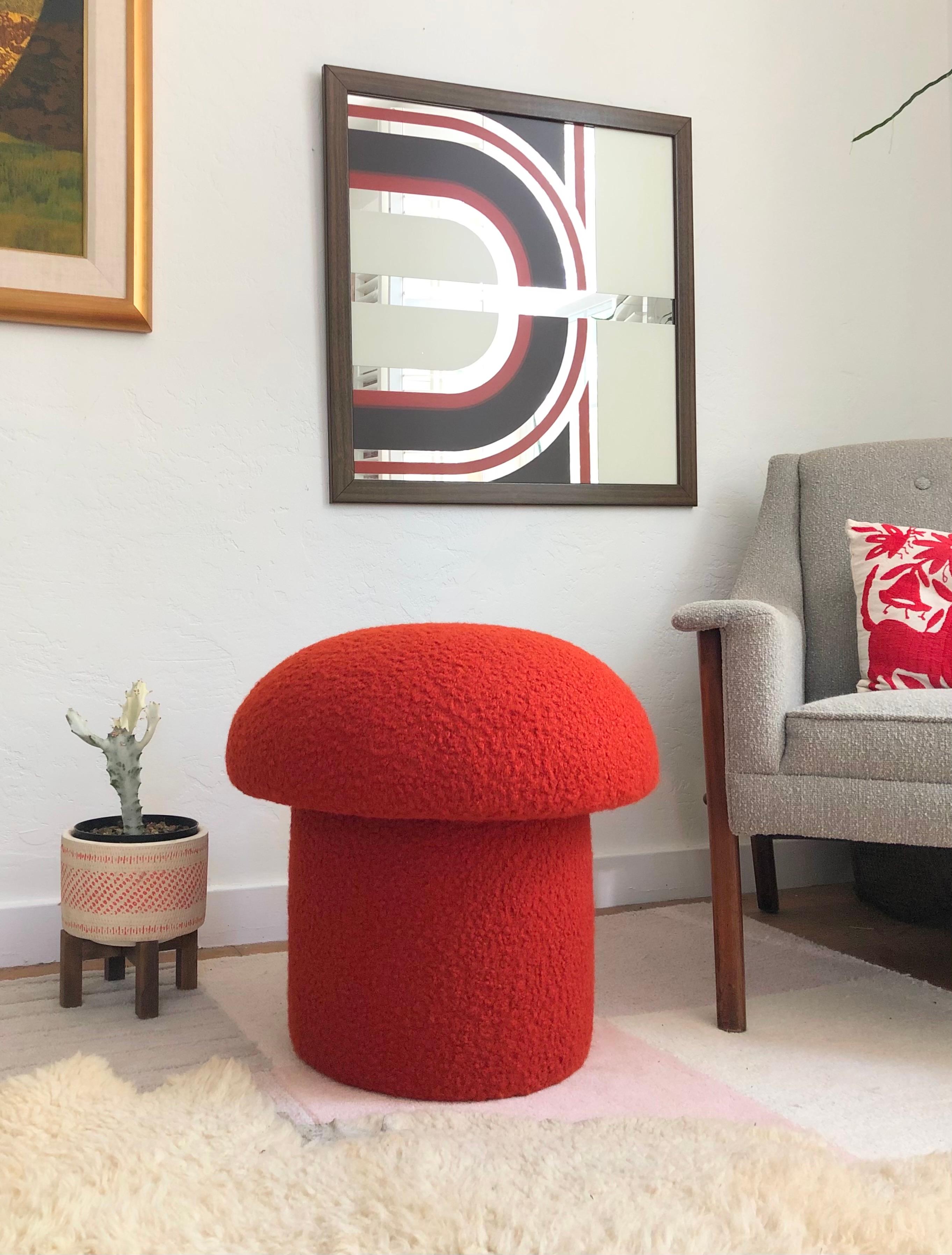 A handmade mushroom shaped ottoman, upholstered in a red-orange colored curly boucle fabric. Perfect for using as a footstool or extra occasional seating. A comfortable cushioned seat and sculptural accent piece.
Mushroom ottomans are made to order,