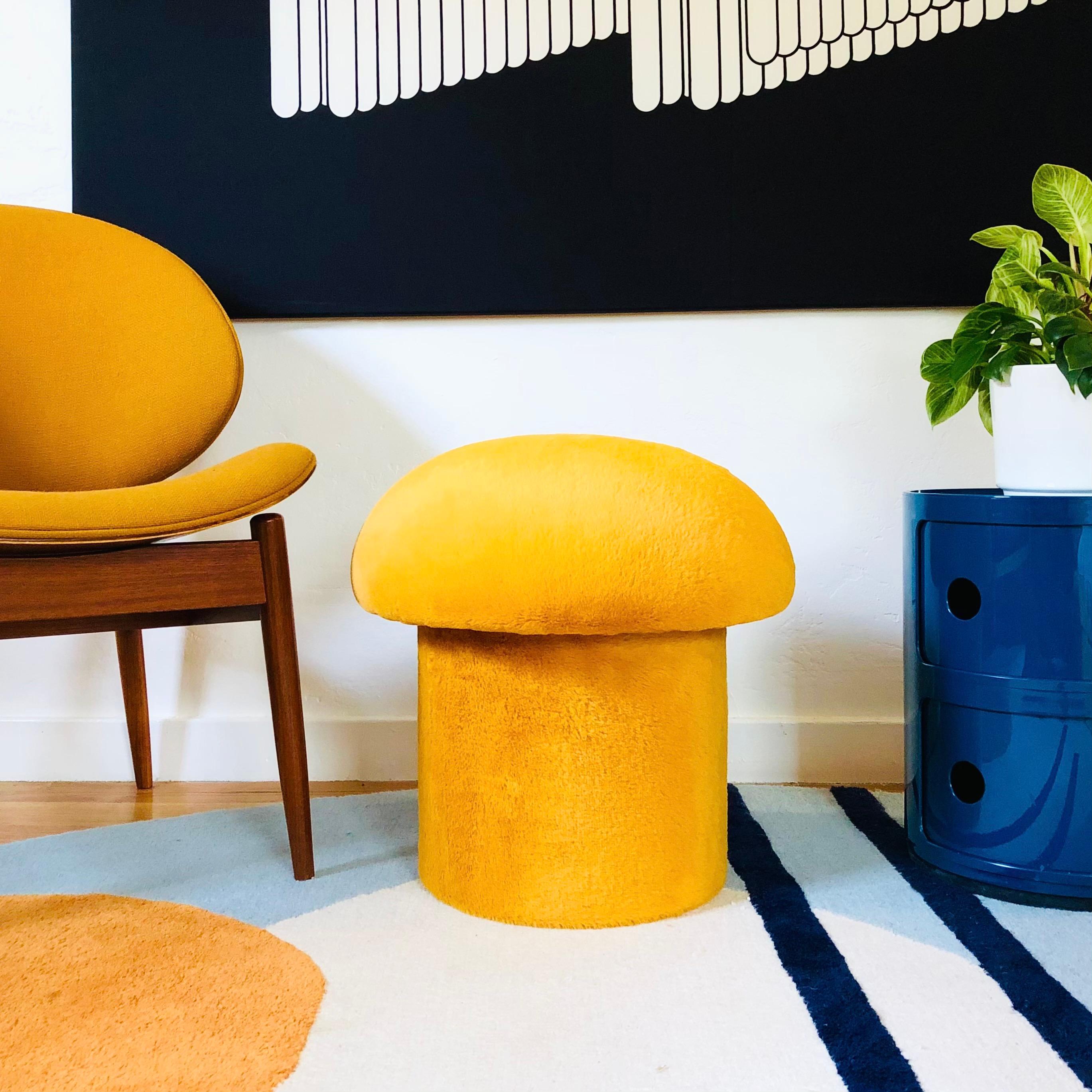 A handmade mushroom shaped ottoman, upholstered in a yellow topaz colored high pile plush fabric. Perfect for using as a footstool or extra occasional seating. A comfortable cushioned seat and sculptural accent piece.
PLEASE NOTE:
Color variations
