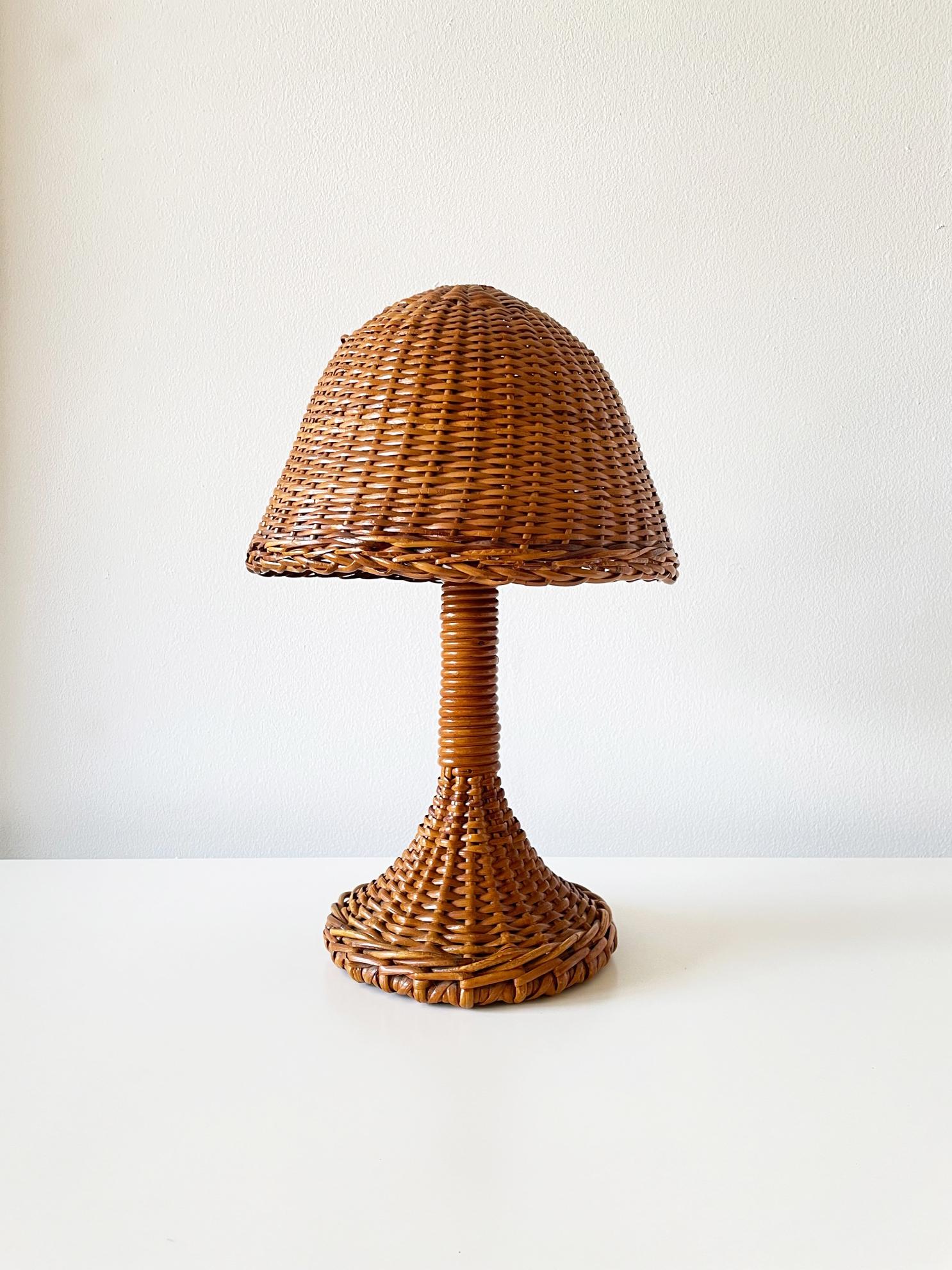 This charming Mushroom-shaped table lamp is handmade of tightly woven rattan in a rich chestnut color. This skillful form is simple, expressive and charming. It has a great patina. This lamp has been freshly rewired with an on/off toggle switch