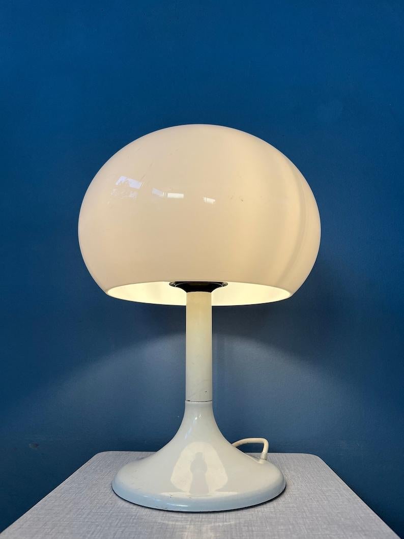 White mushroom table lamp by the Dutch brand Dijkstra. The white acrylic glass shade produces a nice and warm light. The lamp requires one E27/26 (standard) lightbulb and currently has an EU-plug.

Additional information:
Materials: Metal,