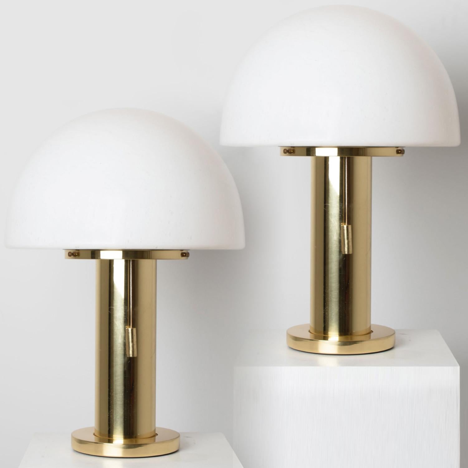 Mushroom table lamp with white satin glass and a brass base. Designed and manufactured by Limburg Glashütte, Germany in 1970.
The lamp has an organic shape of a mushroom. It is in perfect condition, great design from the
