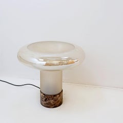 "Mushroom" table lamp with a marble base and an opal glass shade.