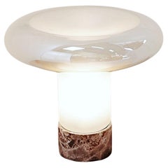 "Mushroom" table lamp with a marble base and an opal glass shade.