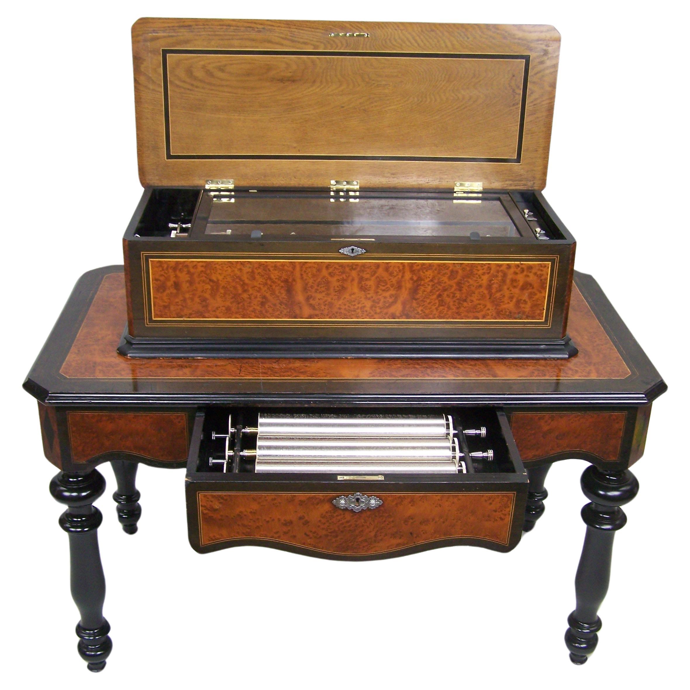 Music box on table with 4 interchangeble cylinders