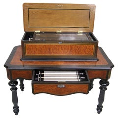 Antique Music box on table with 4 interchangeble cylinders