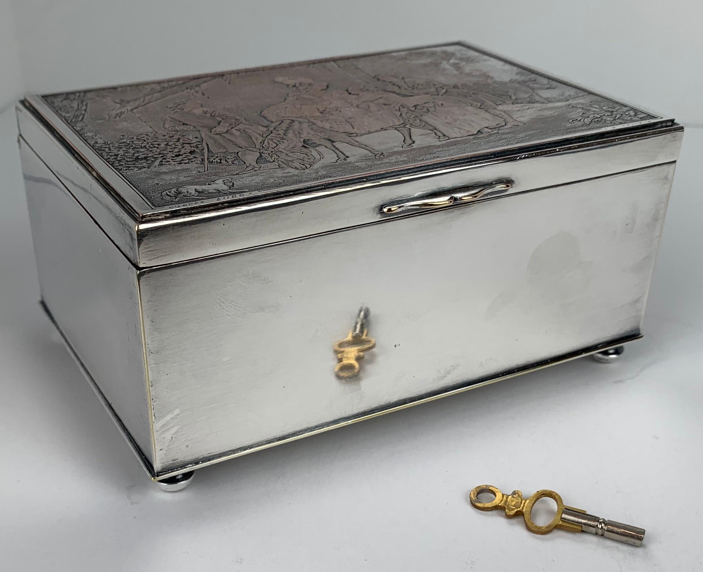 Silver on copper music box with engraved scene 