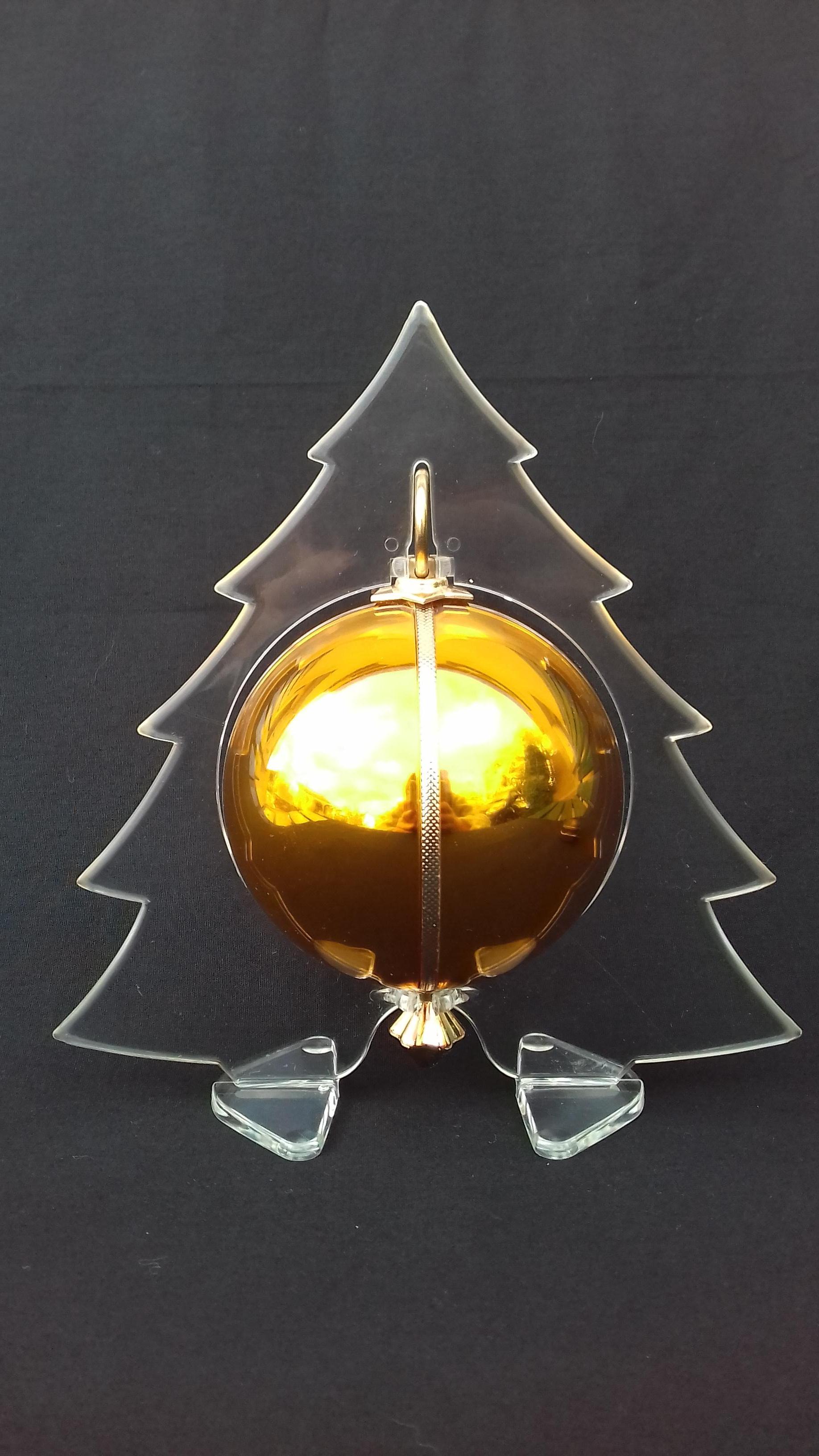 Pull the string, put the tree on your table, and listen to the magic of Christmas

Rare and Gorgeous Christmas Ball Music Box 

Pull the hook, a string will come out and go into the ball playing 