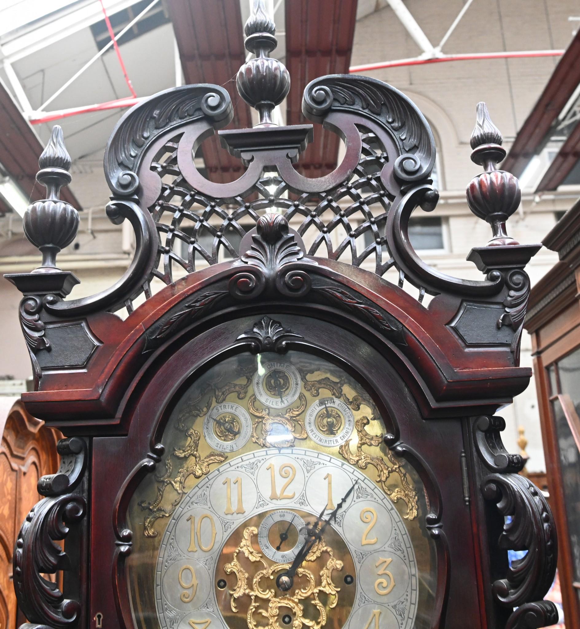 You are viewing a large musical grandfather clock with an intricately carved long case
Maker is John Boyd of Glasgow, Scotland as inscribed on face
Look at all the carved details, definitely the work of a skilled hand
Clock features Westminster and