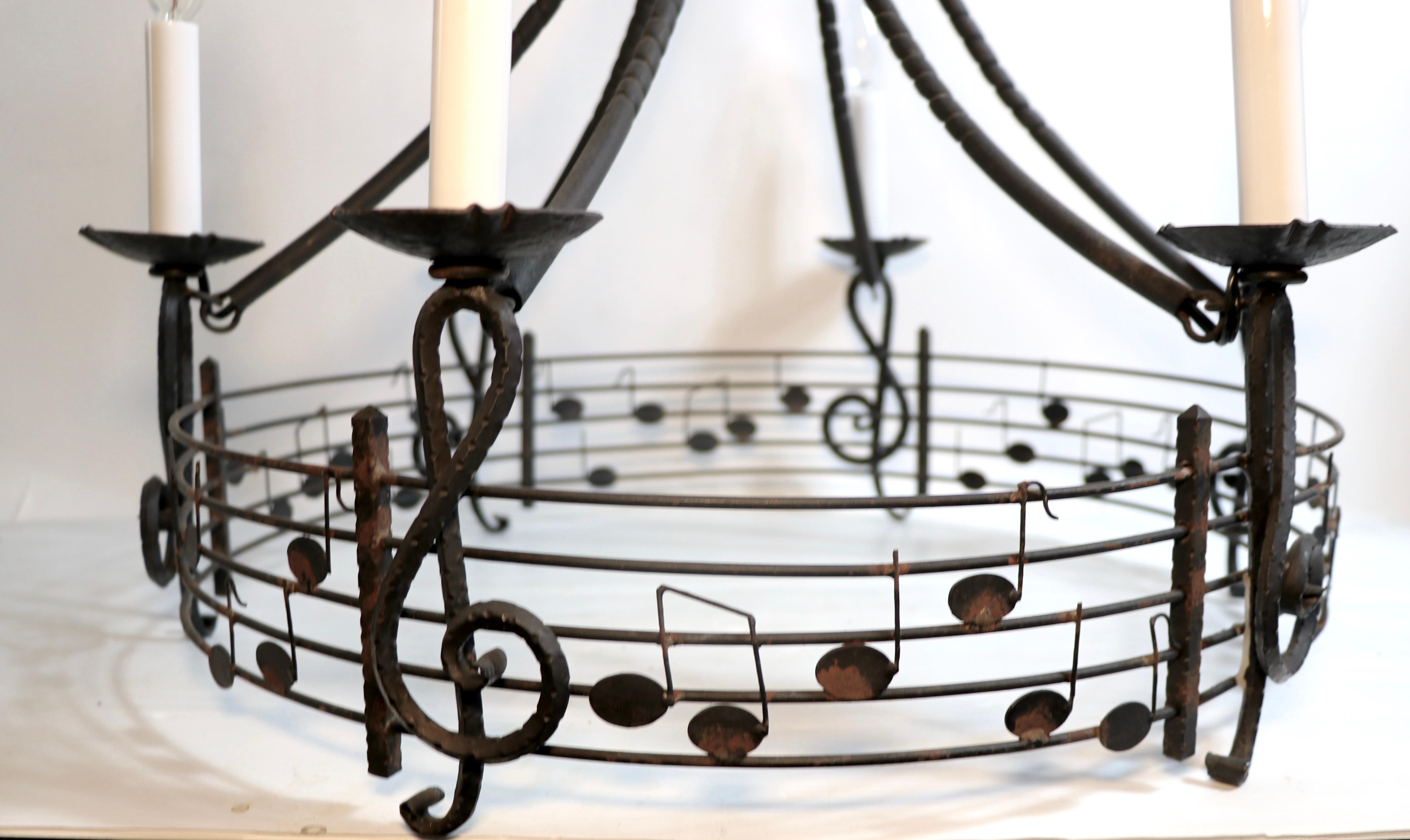 Great Brutalist wrought iron six light chandelier having a musical note, clef, and staff motif. Marked Made in Hungary, circa 1970's, newly professionally rewired.