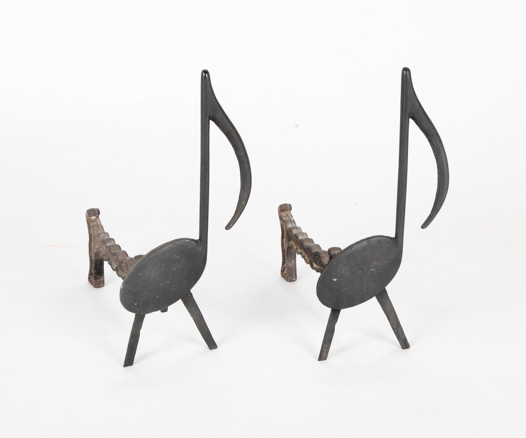 Musical note wrought iron andirons stamped Nashville TN, circa 1920s.