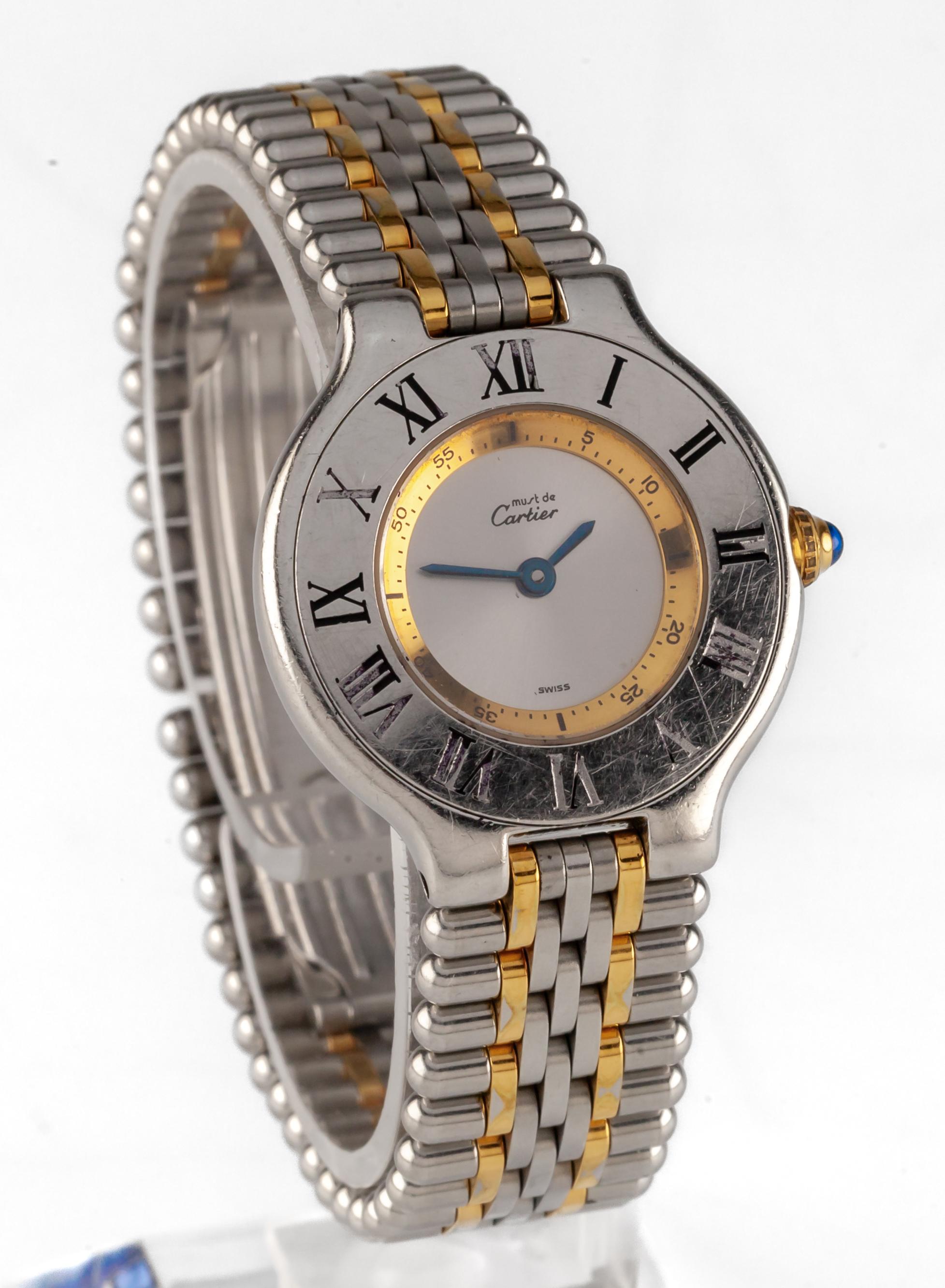 Must de Cartier 21 Women's Two Tone Stainless Steel Quartz Watch Vintage 1340
Movement #90.06
Case #1340.PL1419XX

Stainless Steel Case w/ Roman Numeral Bezel
28 mm in Diameter
Lug-to-Lug Distance = 31 mm
NOTE: Enameling in Bezel is rubbing