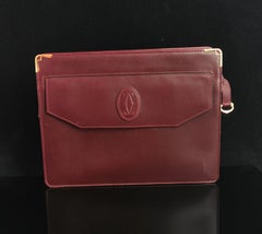 Must De Cartier oxblood leather clutch purse