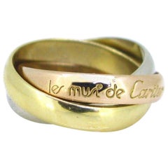 Must de Cartier Trinity Rolling Yellow White Rose Three-Color Gold Band Ring